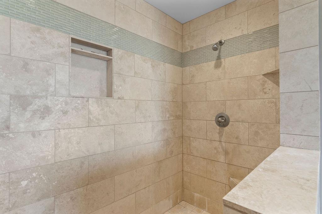 4930 South Faith Home Road Turlock, CA 95380 - Photo 41 of 69 Primary bathroom featuring a travertine walk-in shower