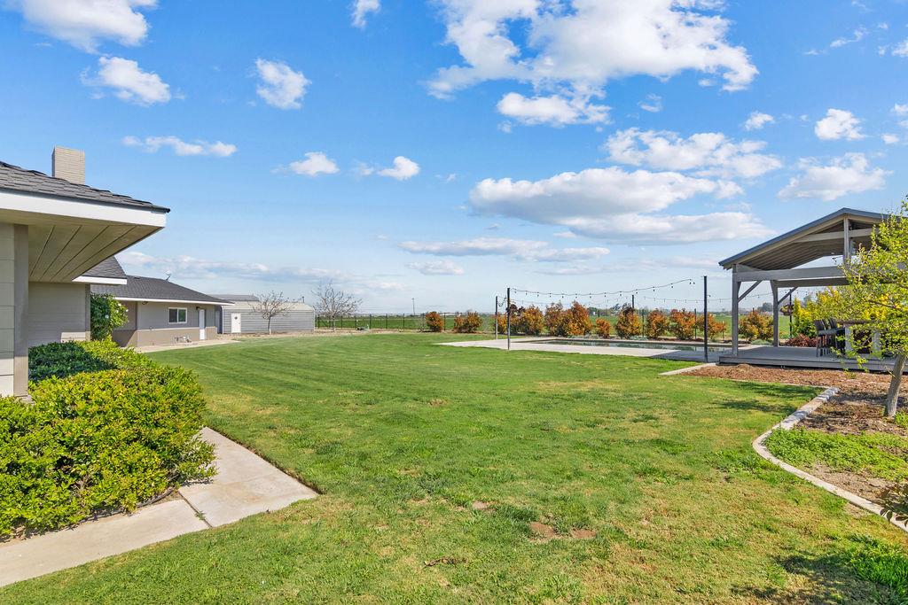 4930 South Faith Home Road Turlock, CA 95380 - Photo 51 of 69 view of yard with a pool