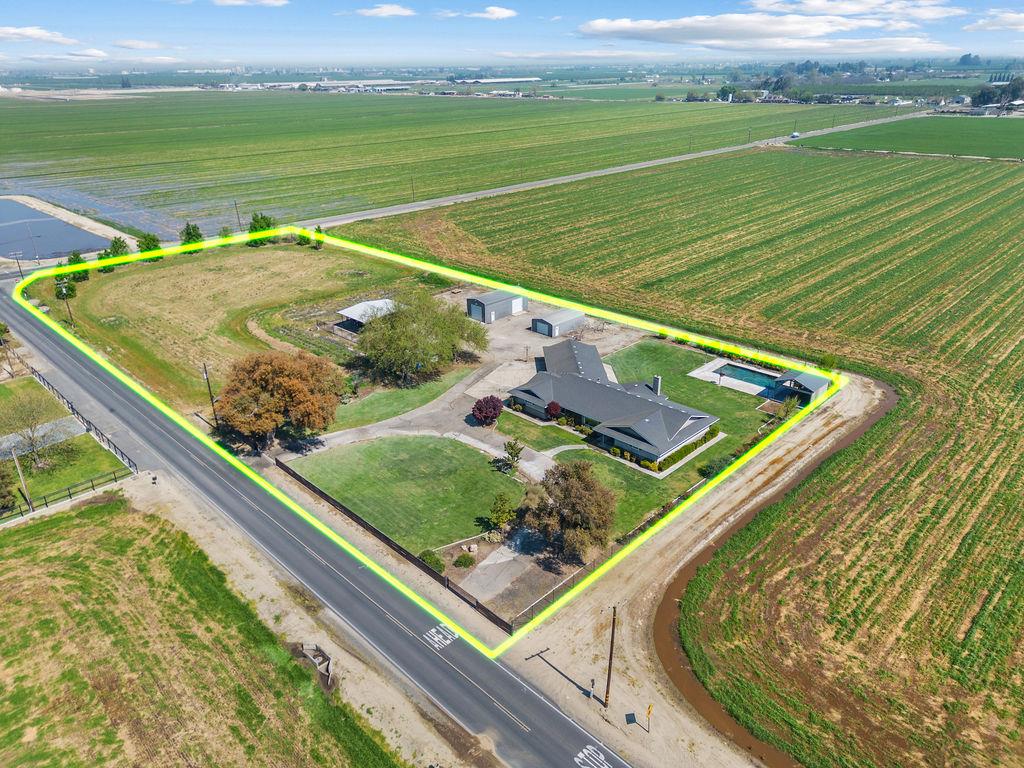 4930 South Faith Home Road Turlock, CA 95380 - Photo 59 of 69 aerial view of sparsely populated area featuring rows of crops and property parcel outlined
