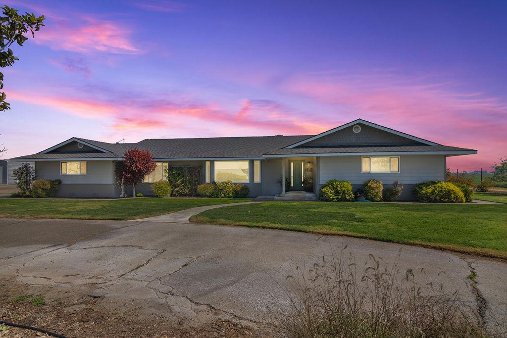 4930 South Faith Home Road Turlock, CA 95380 - Photo 63 of 69 ranch-style house featuring a lawn and covered porch