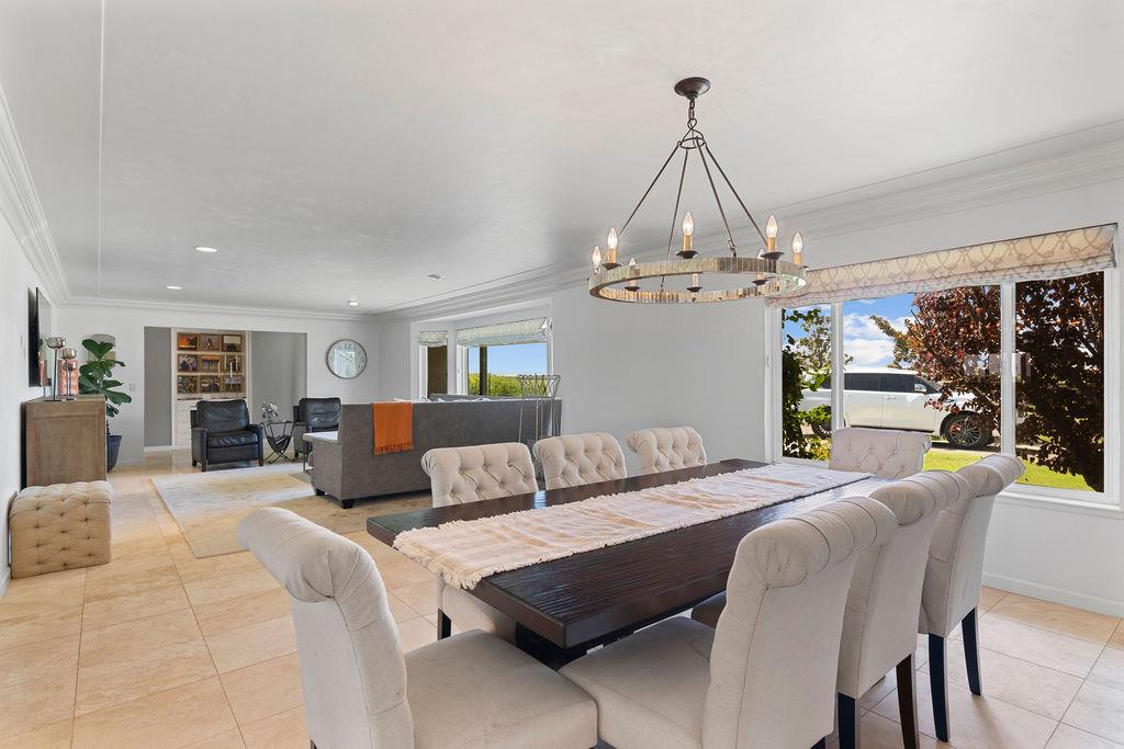 4930 South Faith Home Road Turlock, CA 95380 - Photo 9 of 69 dining space with crown molding, suspended lighting, and light tile patterned floors