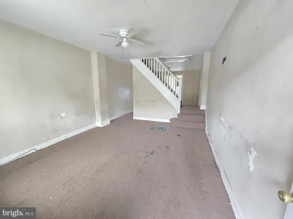 a view of a hallway with staircase