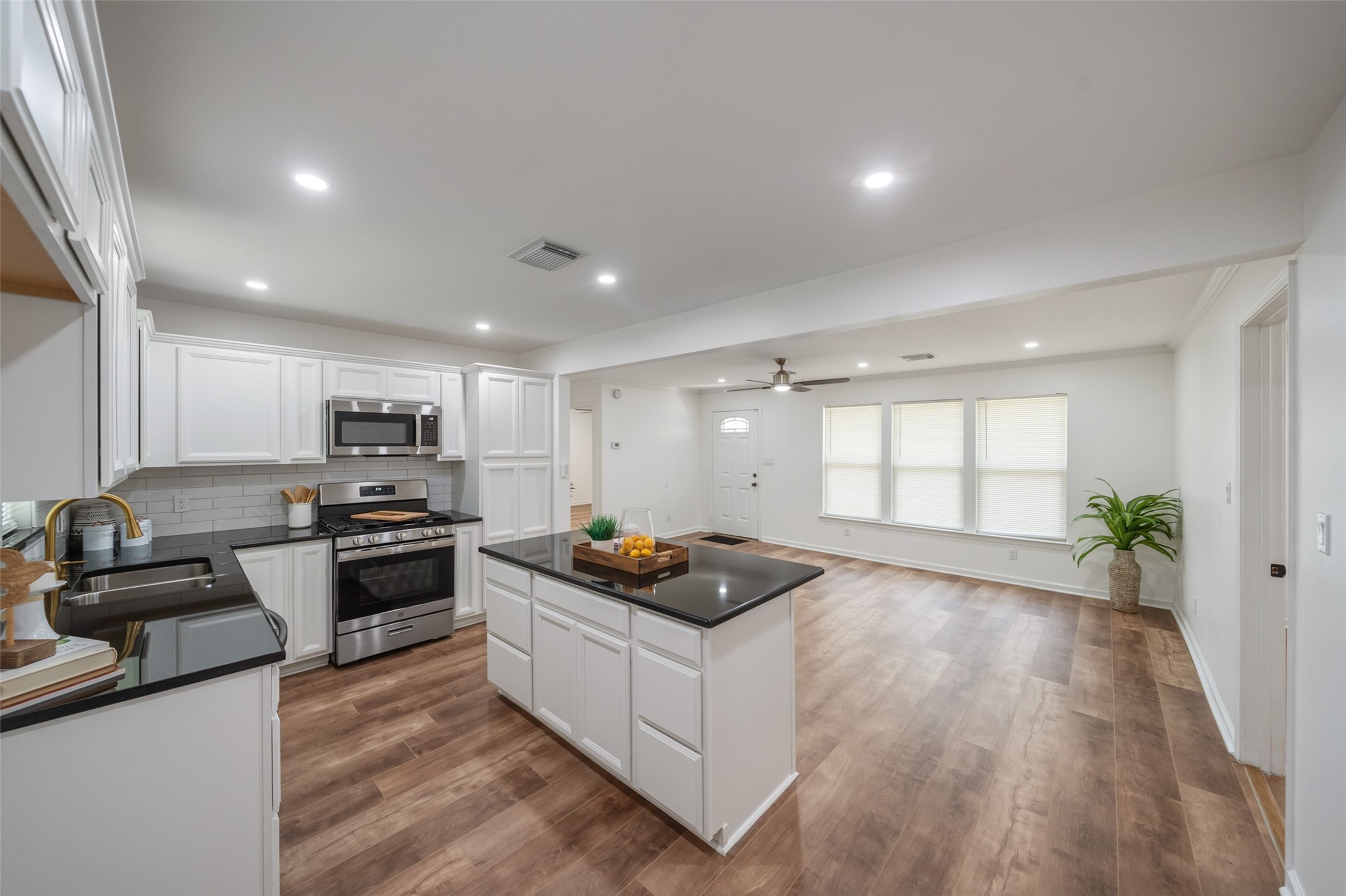 3051 Rothermel Road Houston, TX 77093 - Photo 9 of 24 Modern kitchen featuring sleek granite countertops and stylish updated cabinetry.
