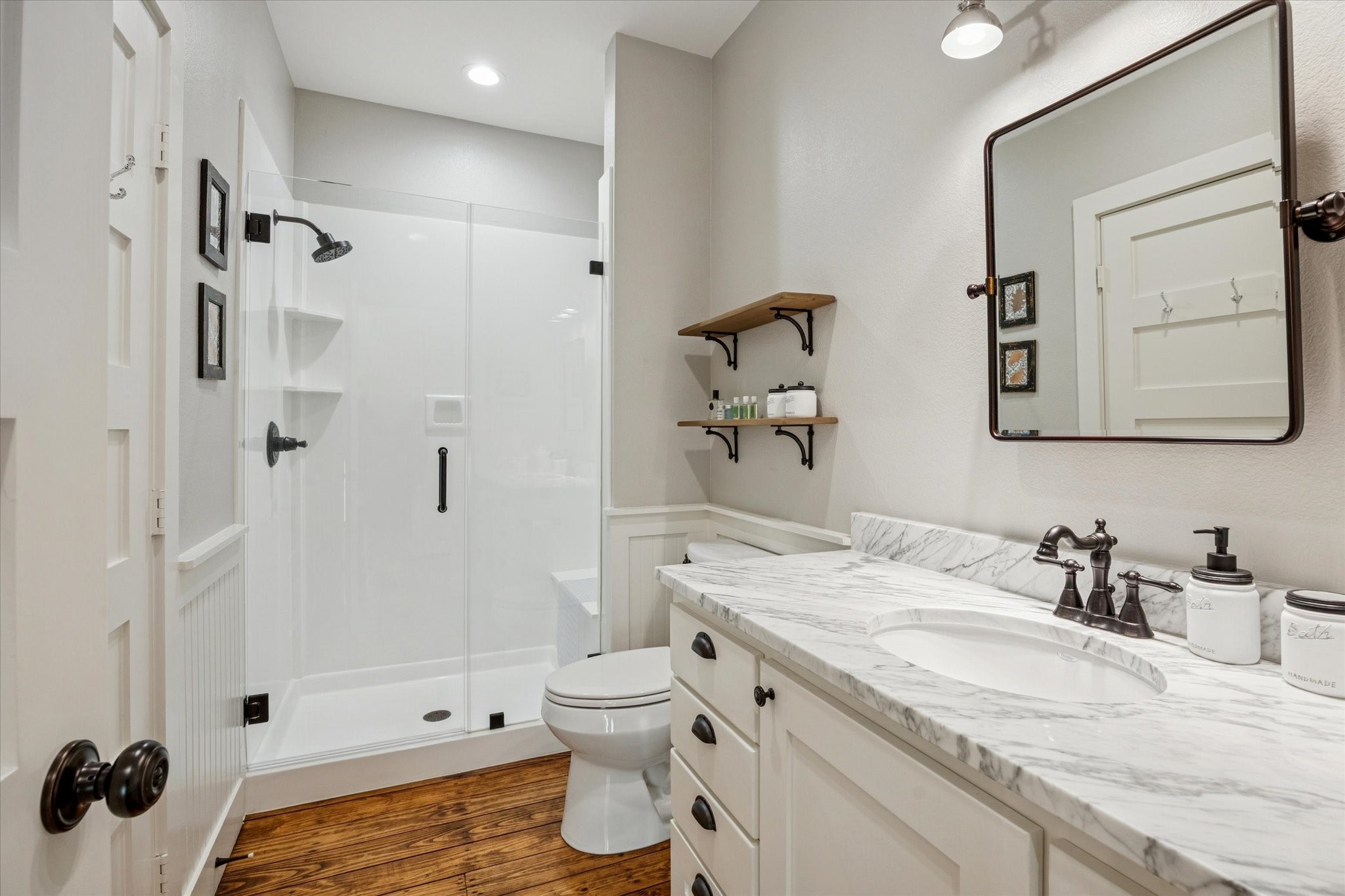 8611 Halamicek Loop Fayetteville, TX 78940 - Photo 17 of 41 a bathroom with a granite countertop sink toilet and shower glass cabinet