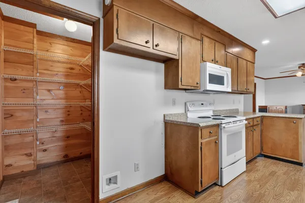 a kitchen with stainless steel appliances granite countertop a stove and a microwave