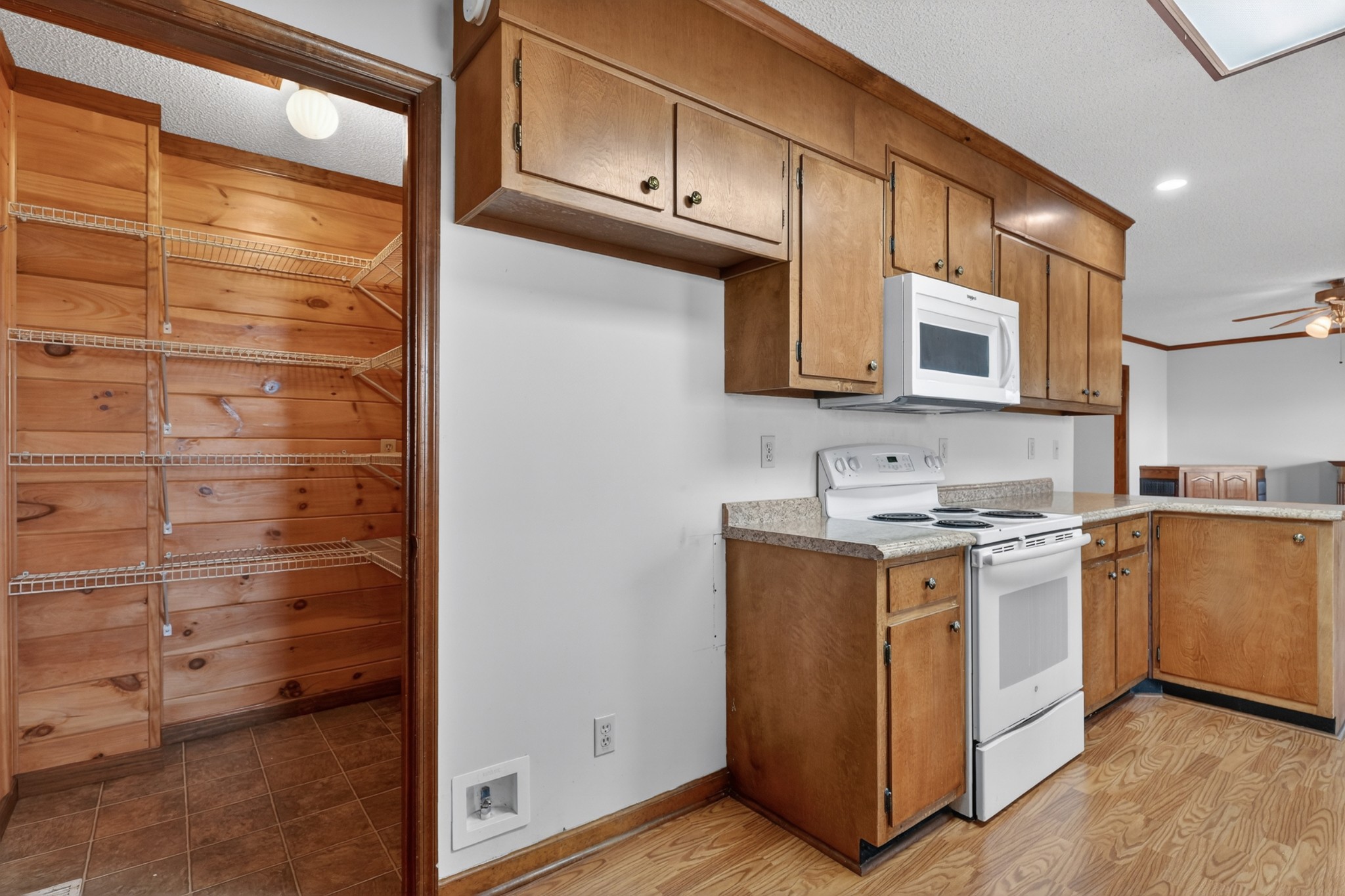 679 Howell Hill Road Flintville, TN 37335 - Photo 13 of 44 a kitchen with stainless steel appliances granite countertop a stove and a microwave