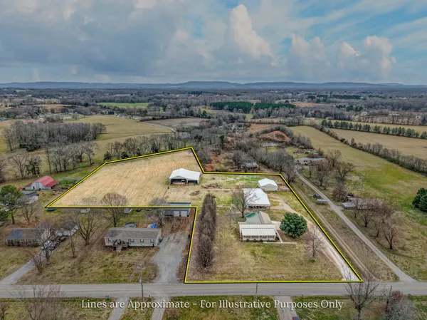 an aerial view of a house with outdoor space