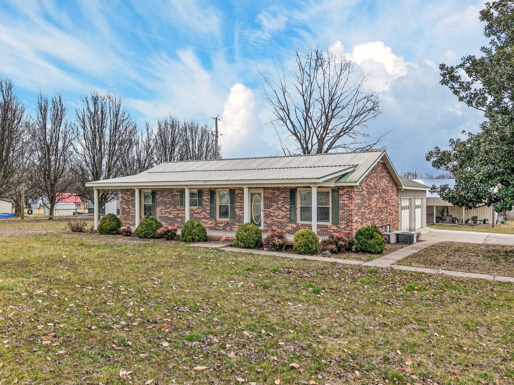 679 Howell Hill Road Flintville, TN 37335 - Photo 42 of 44 a front view of a house with garden