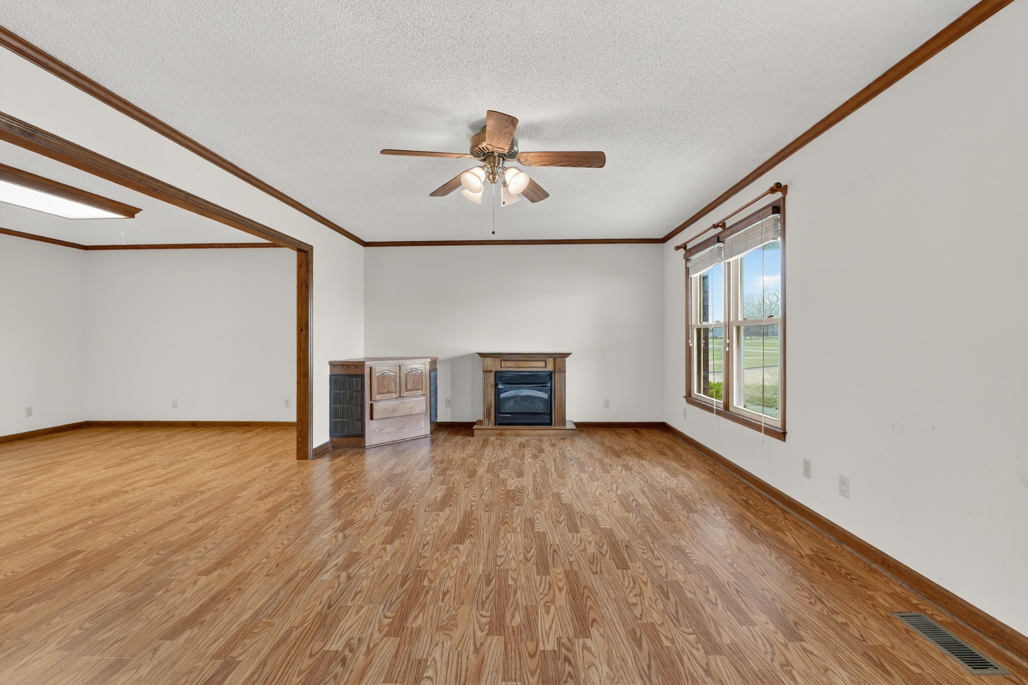 679 Howell Hill Road Flintville, TN 37335 - Photo 7 of 44 a view of an empty room with wooden floor and a window