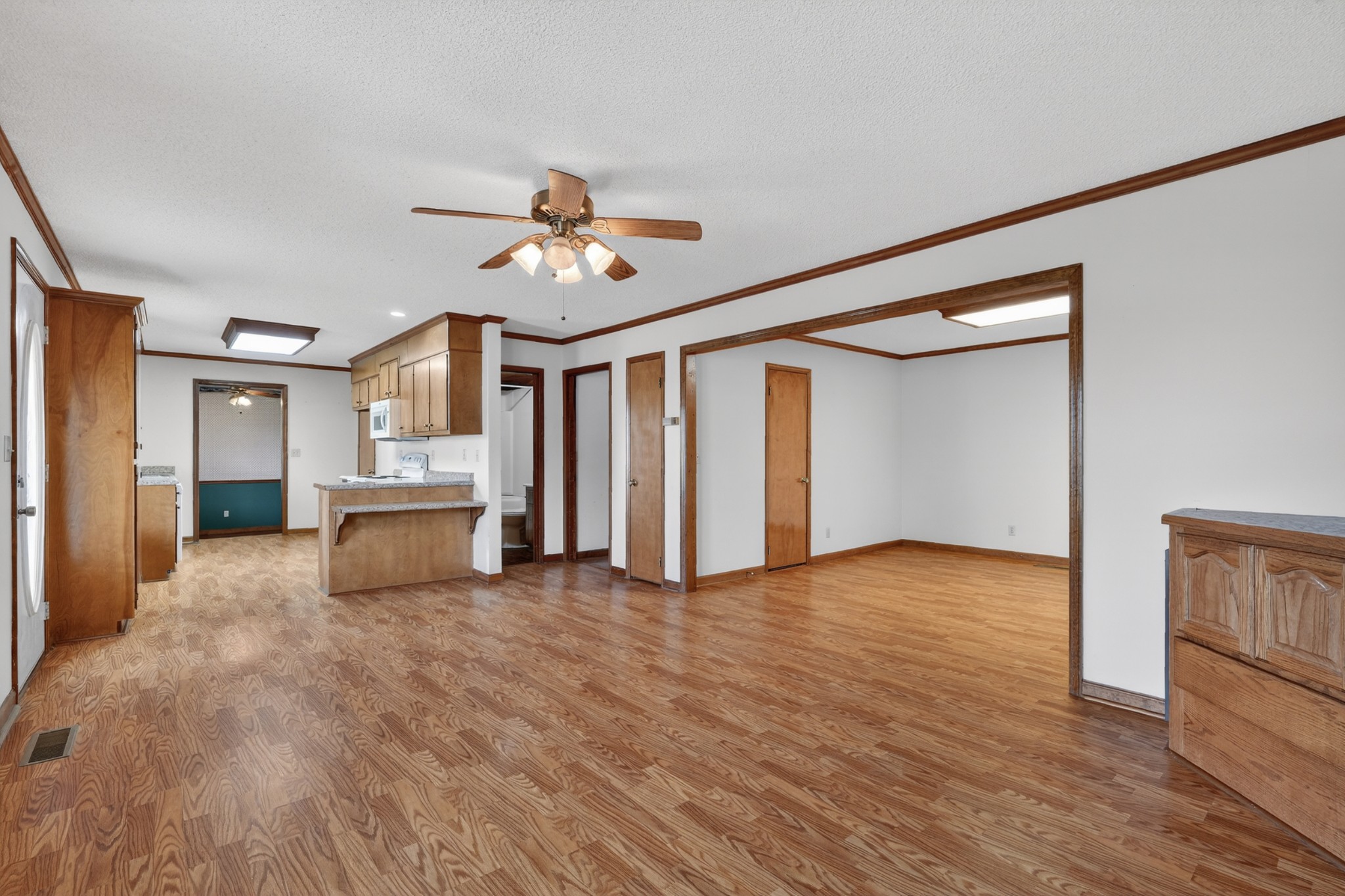 679 Howell Hill Road Flintville, TN 37335 - Photo 9 of 44 a view of an empty room with a window and wooden floor