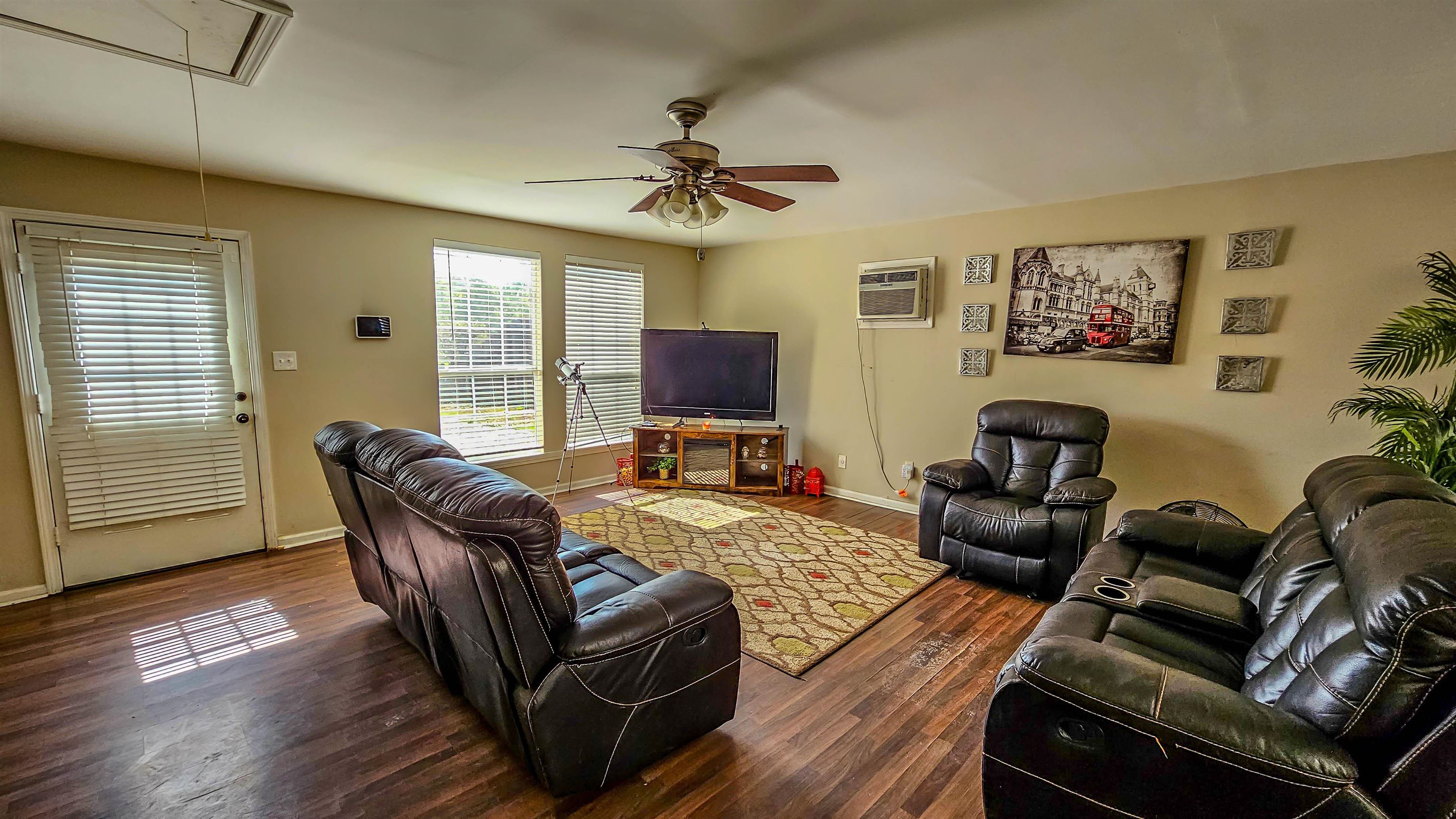 3735 Rippling Creek Cove Memphis, TN 38135 - Photo 12 of 28 a living room with furniture fireplace and a flat screen tv