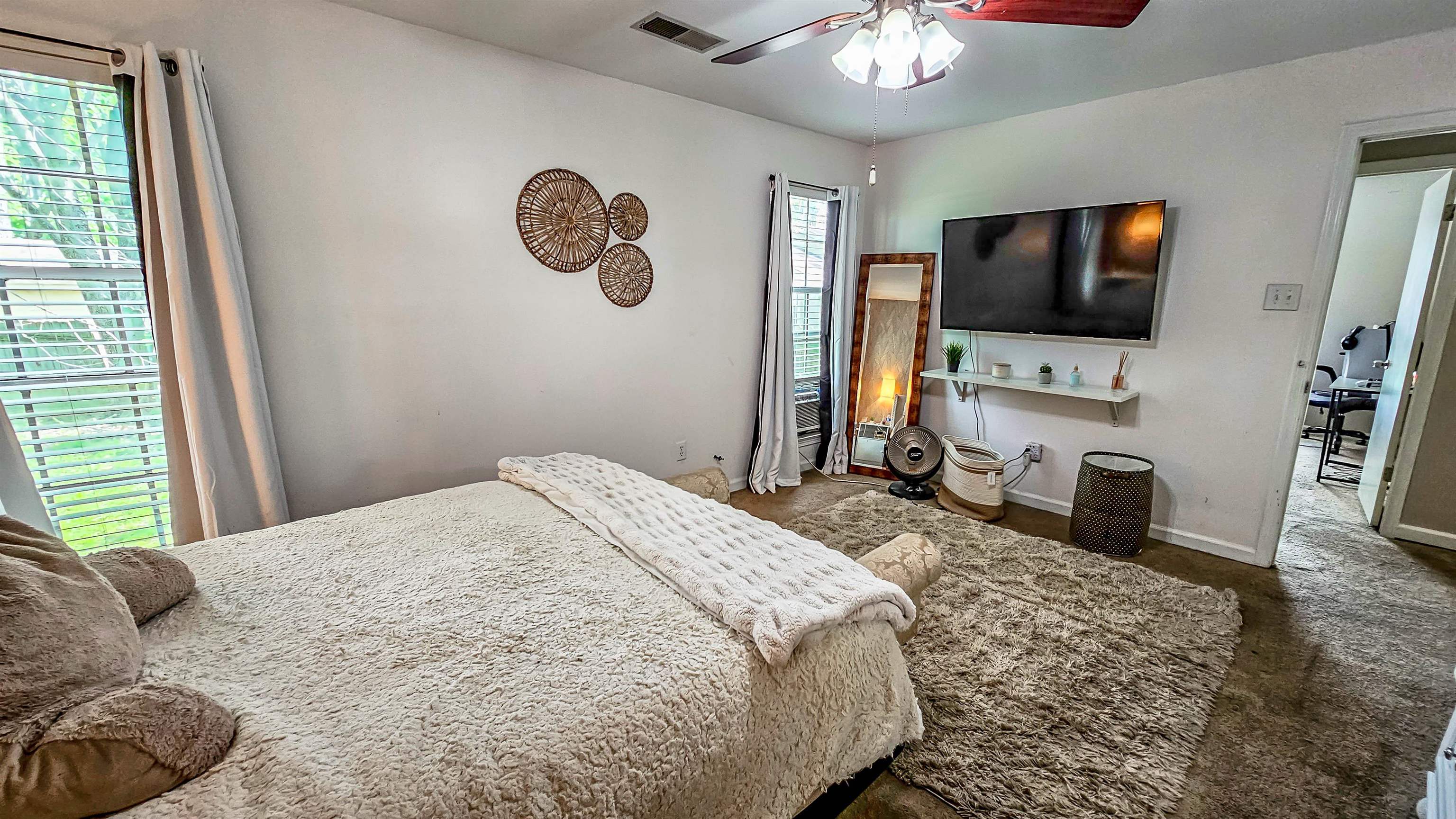 3735 Rippling Creek Cove Memphis, TN 38135 - Photo 17 of 28 a bedroom with a bed and a flat screen tv