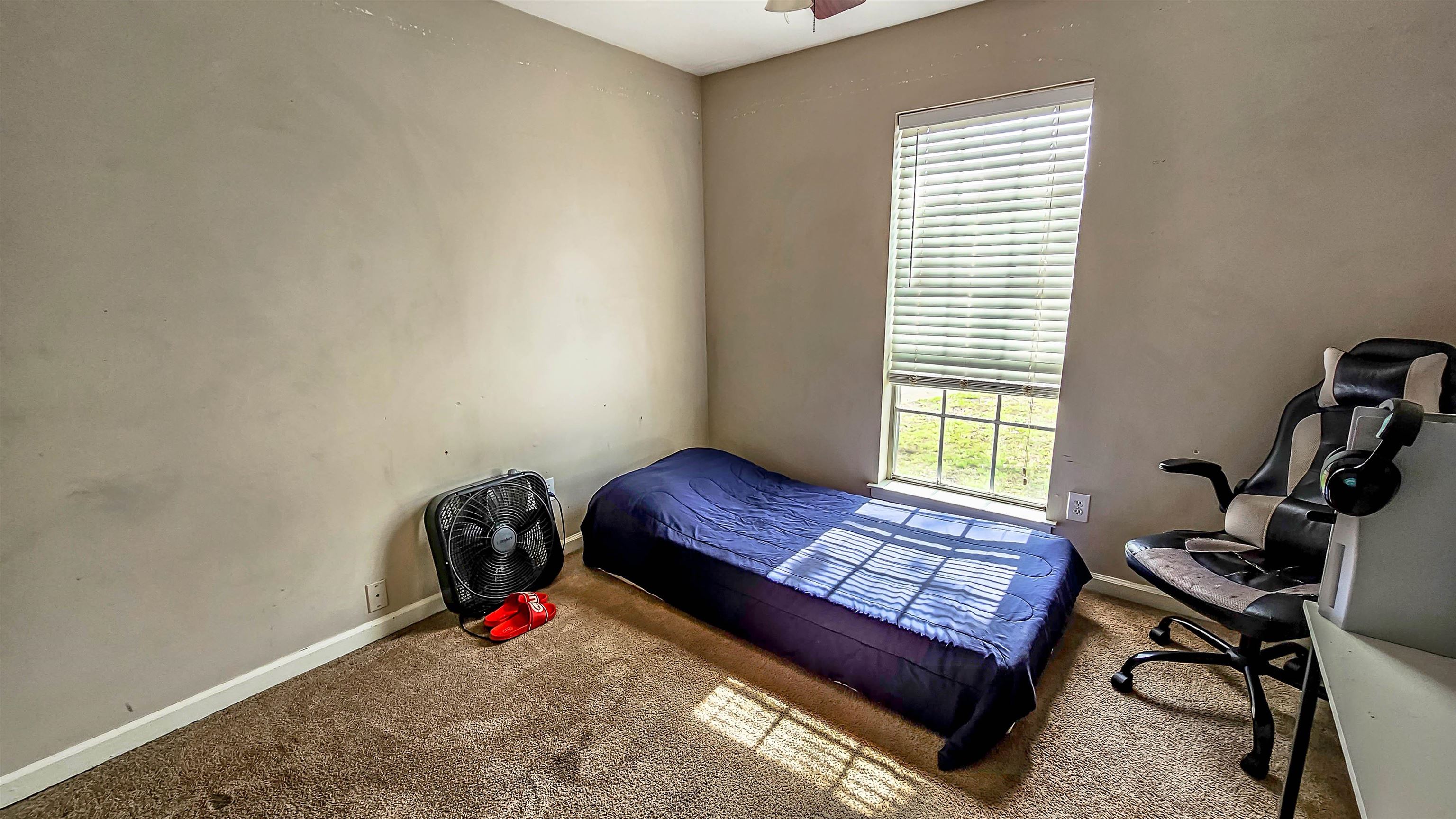 3735 Rippling Creek Cove Memphis, TN 38135 - Photo 21 of 28 a bedroom with a bed and a window