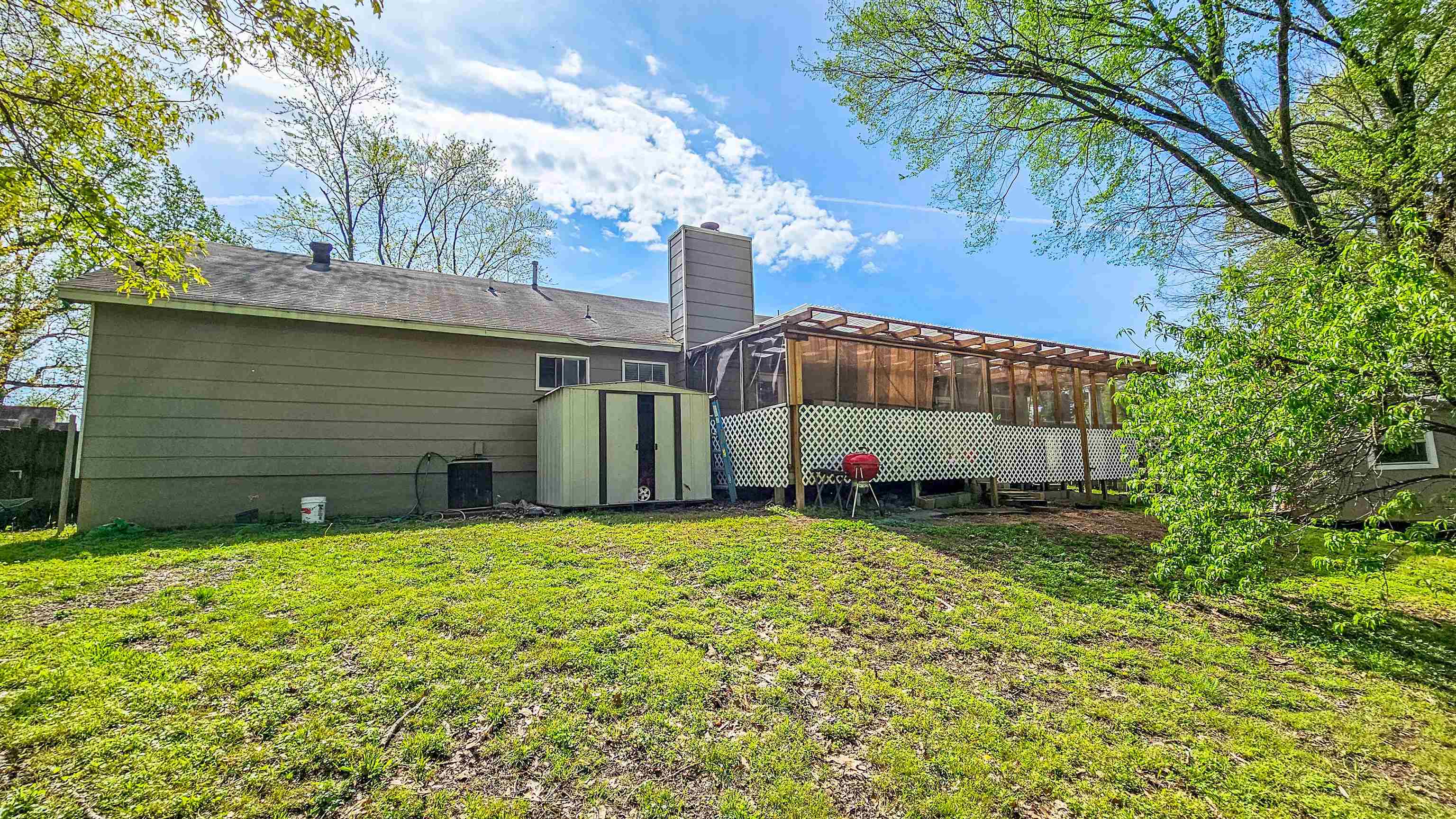 3735 Rippling Creek Cove Memphis, TN 38135 - Photo 27 of 28 a view of a house with a yard