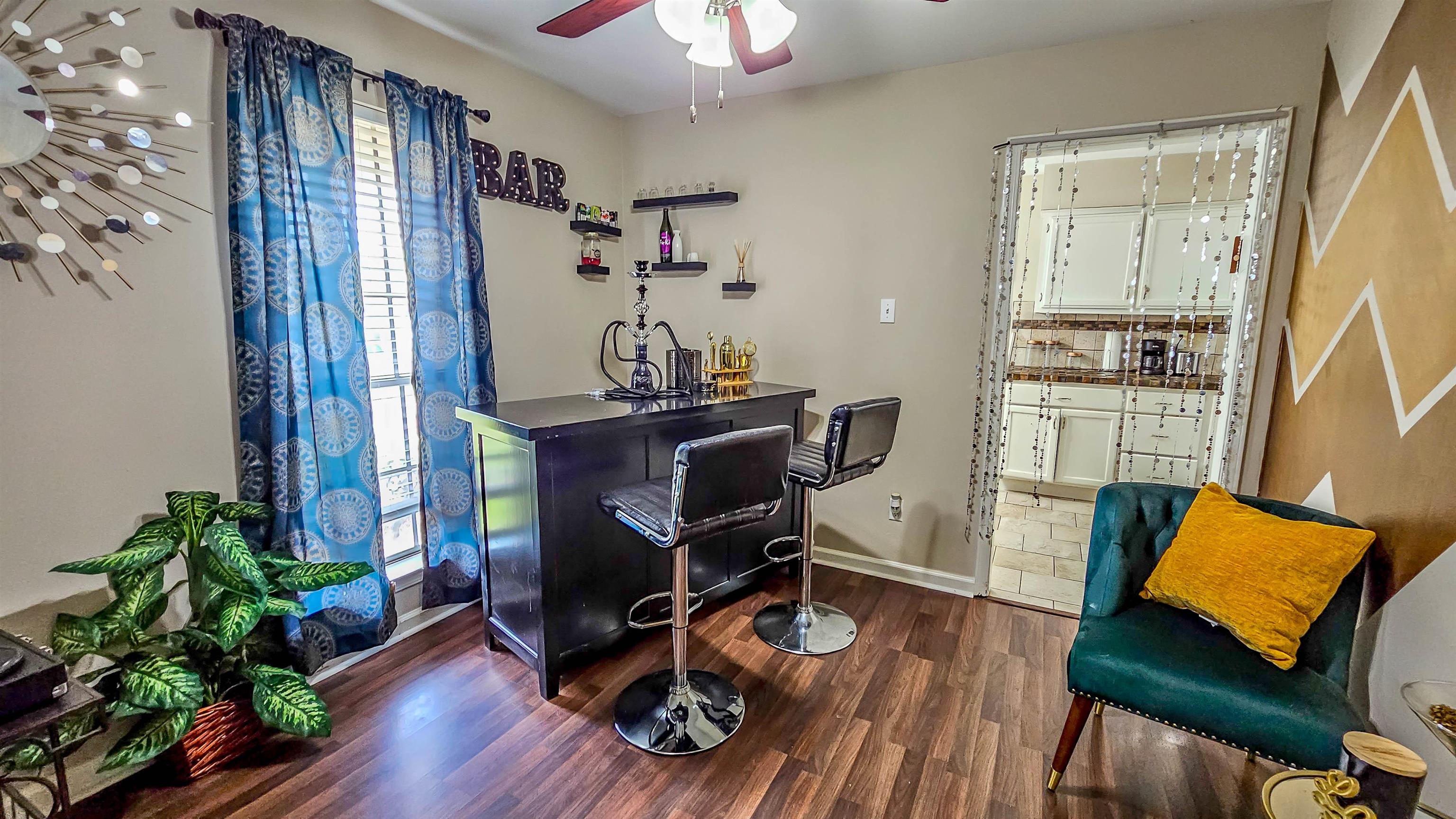 3735 Rippling Creek Cove Memphis, TN 38135 - Photo 6 of 28 a view of a workspace with furniture and wooden floor