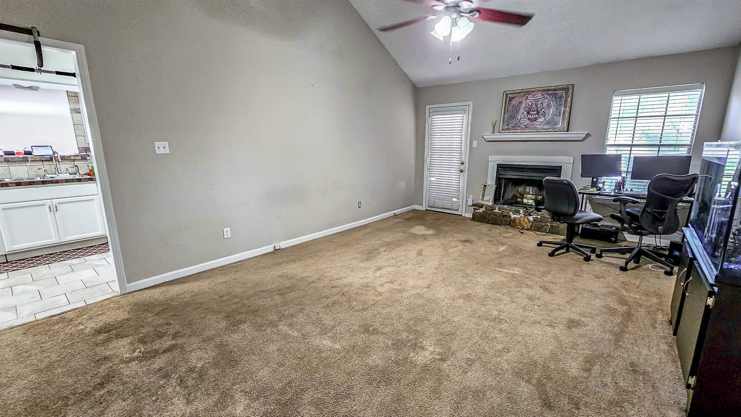 3735 Rippling Creek Cove Memphis, TN 38135 - Photo 7 of 28 a view of a livingroom with a fireplace and a workspace