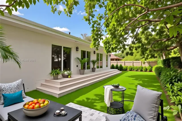 a view of a backyard with sitting area