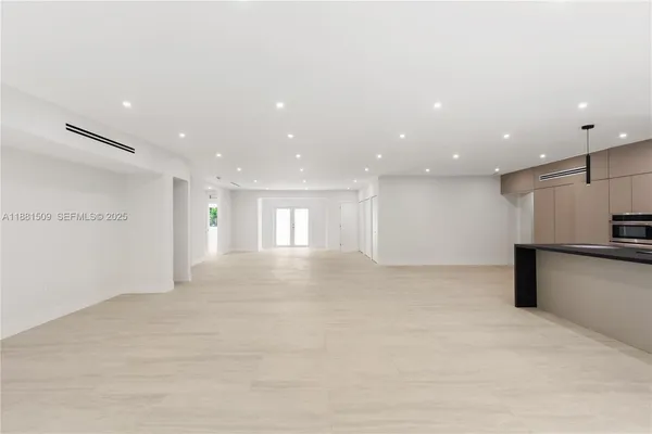 a view of empty room with kitchen appliances