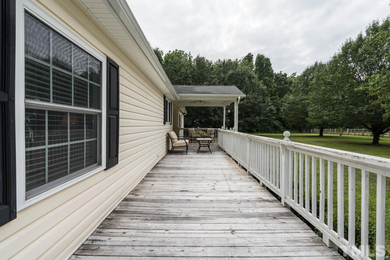 7409 Sidecreek Drive Raleigh, NC 27610 - Photo 3 of 29 a view of a balcony and yard