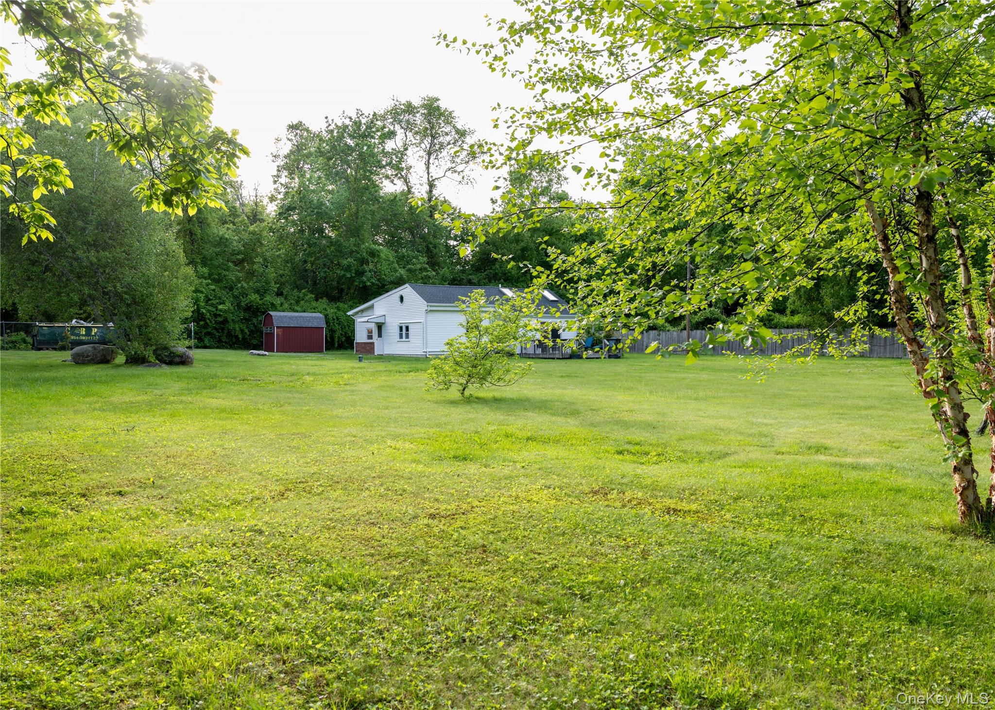 23 Lucille Road Carmel, NY 10512 - Photo 32 of 44 a view of a big yard with a house and large trees