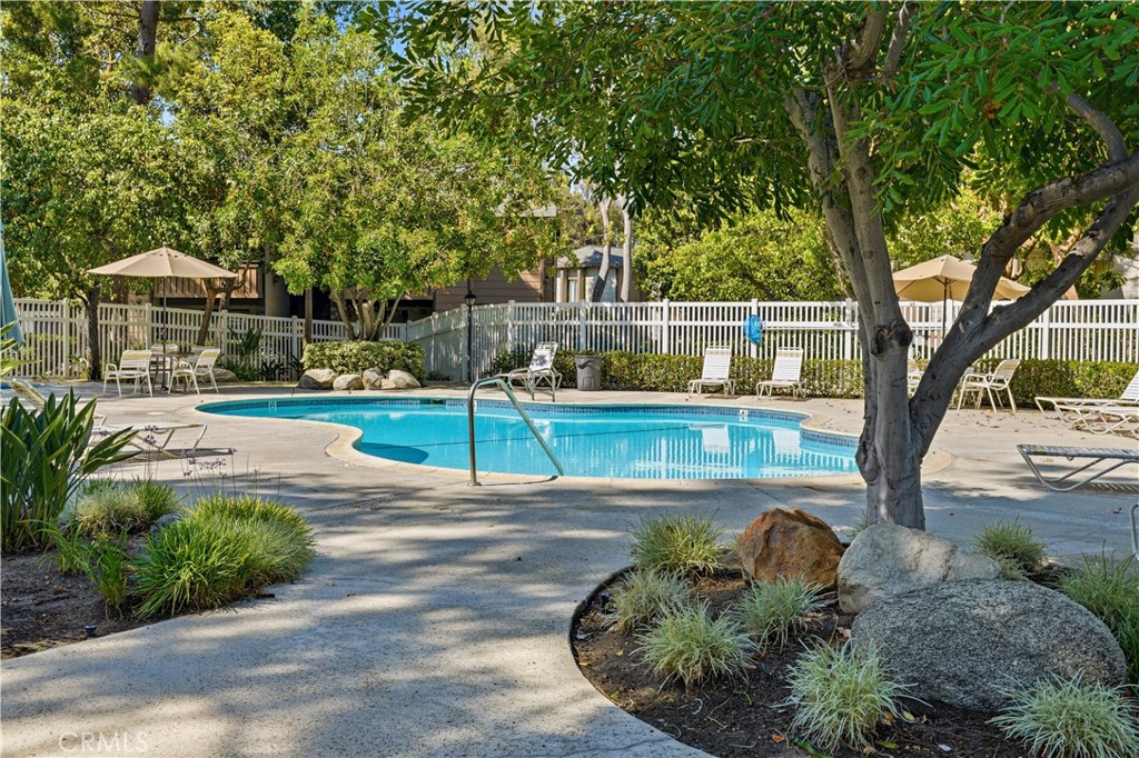 20702 El Toro Road, Unit 231 Lake Forest, CA 92630 - Photo 34 of 36 a view of a swimming pool with a patio