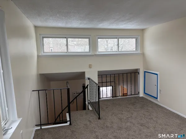 a view of livingroom with furniture and windows