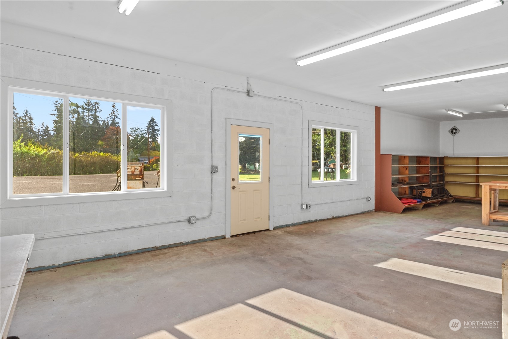 781 Irondale Road Port Hadlock, WA 98339 - Photo 8 of 28 a view of an empty room with a fireplace and a window