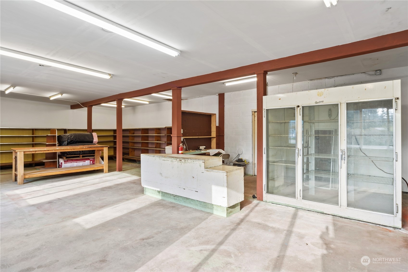 781 Irondale Road Port Hadlock, WA 98339 - Photo 9 of 28 a view of a big room with furniture large windows and kitchen view