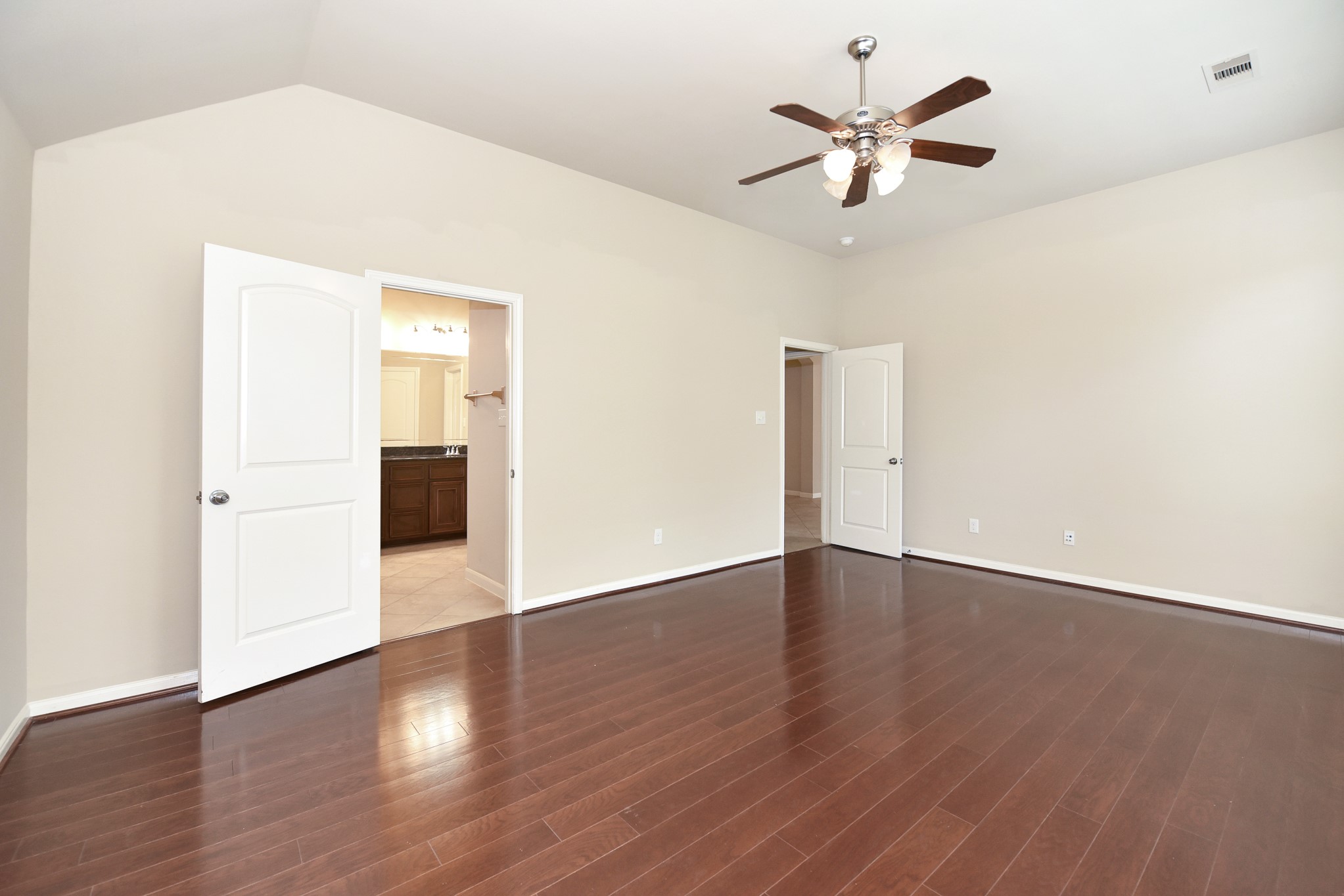 26202 Basil View Lane Katy, TX 77494 - Photo 16 of 29 an empty room with wooden floor and ceiling fan