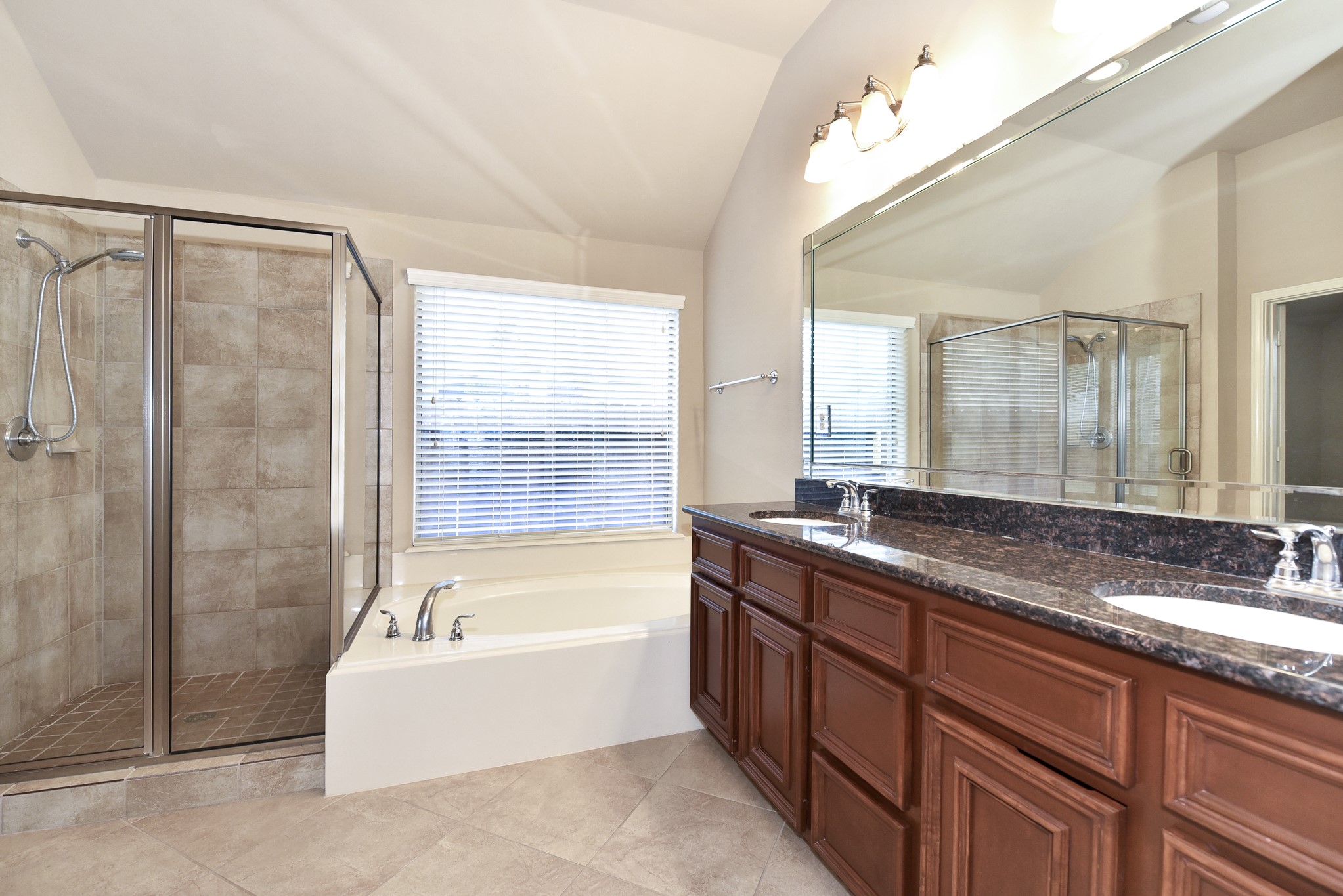 26202 Basil View Lane Katy, TX 77494 - Photo 17 of 29 a spacious bathroom with a granite countertop tub sink shower and mirror