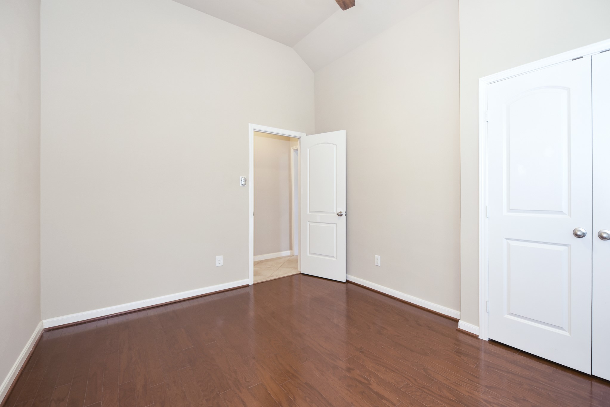 26202 Basil View Lane Katy, TX 77494 - Photo 18 of 29 a view of an empty room with wooden floor