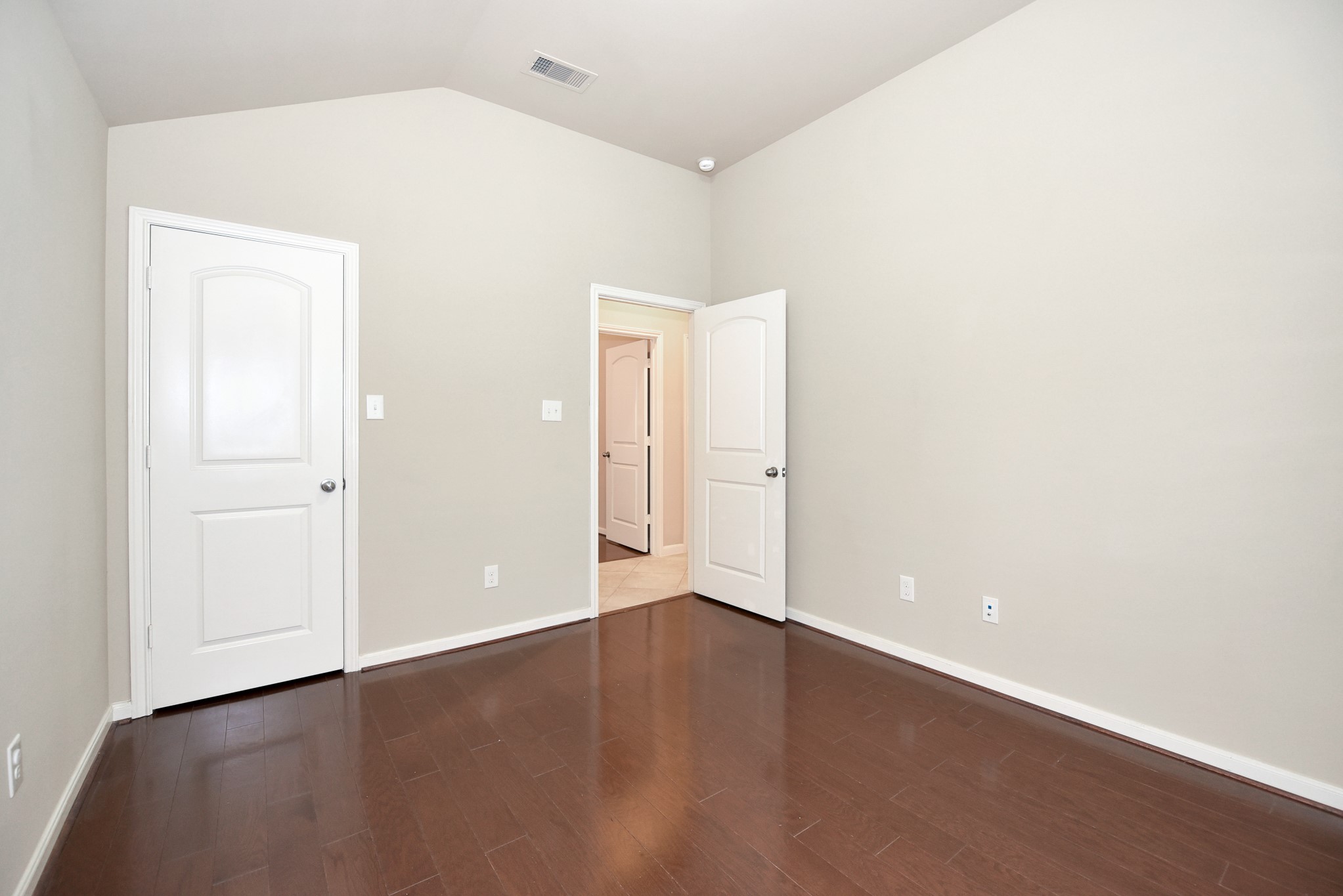 26202 Basil View Lane Katy, TX 77494 - Photo 20 of 29 an empty room with wooden floor and windows