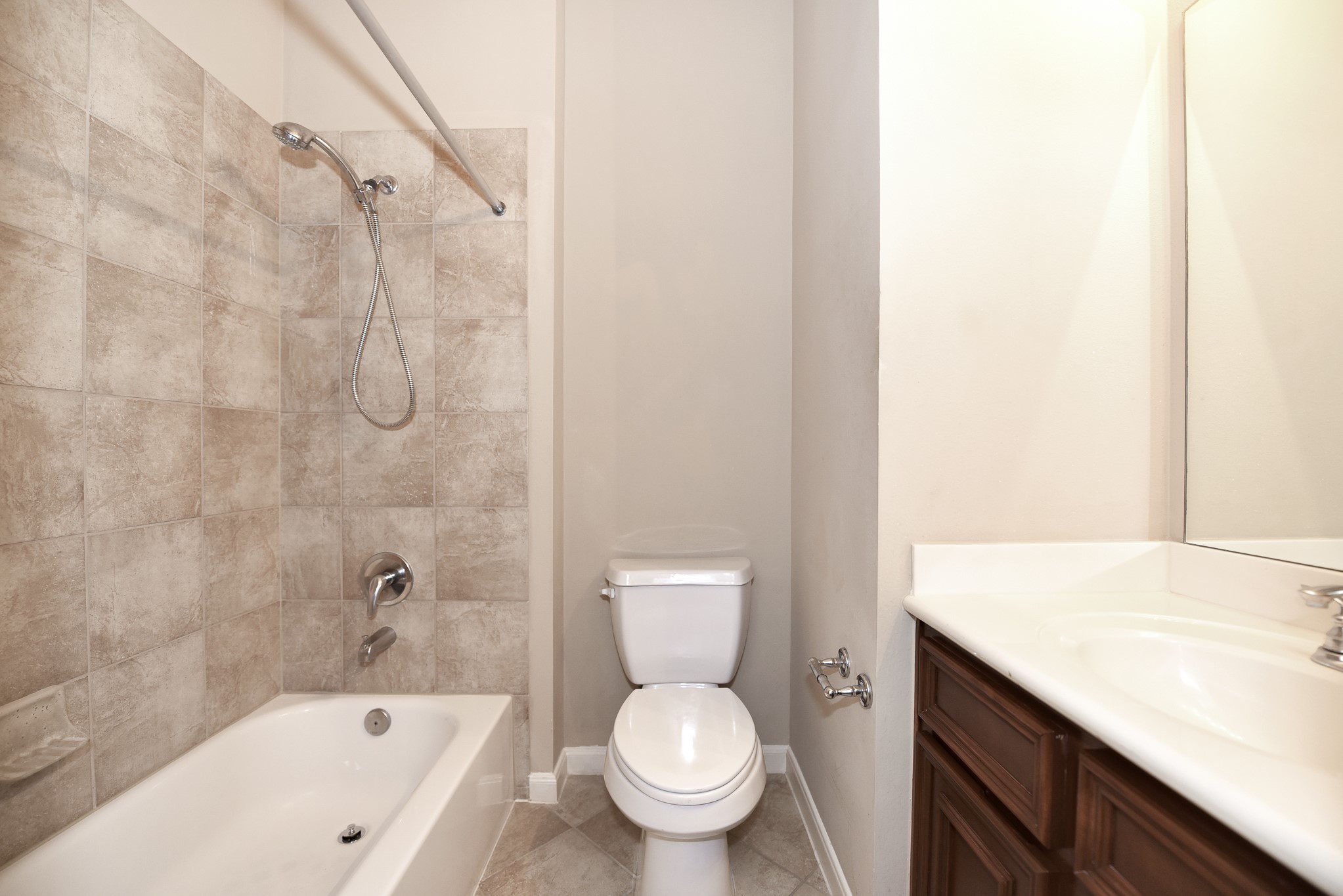 26202 Basil View Lane Katy, TX 77494 - Photo 26 of 29 a bathroom with a granite countertop toilet a sink and a bathtub
