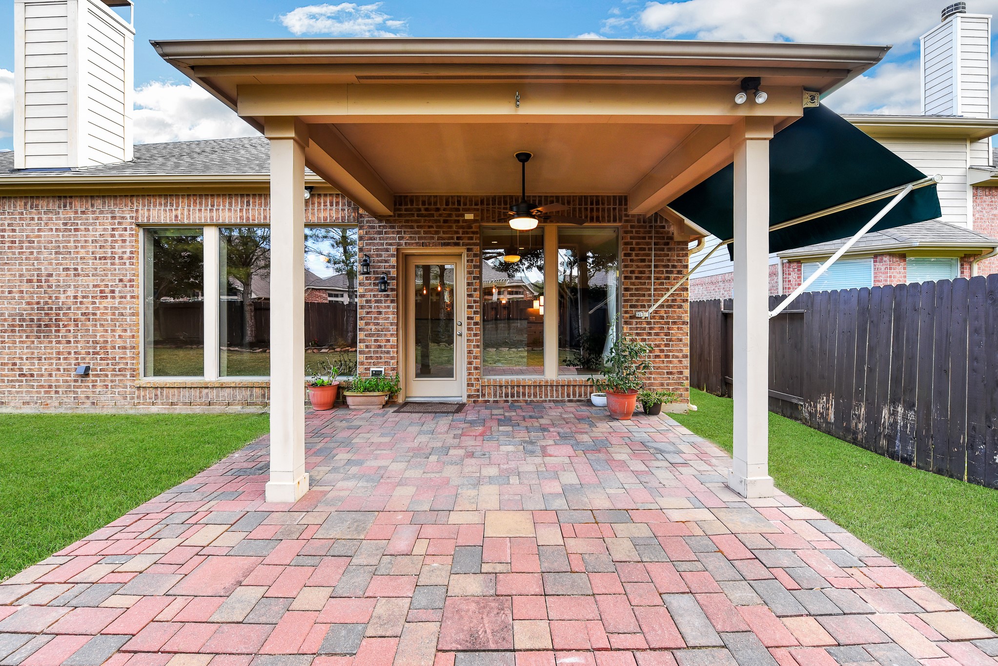 26202 Basil View Lane Katy, TX 77494 - Photo 27 of 29 a view of a porch with a table and chairs under an umbrella