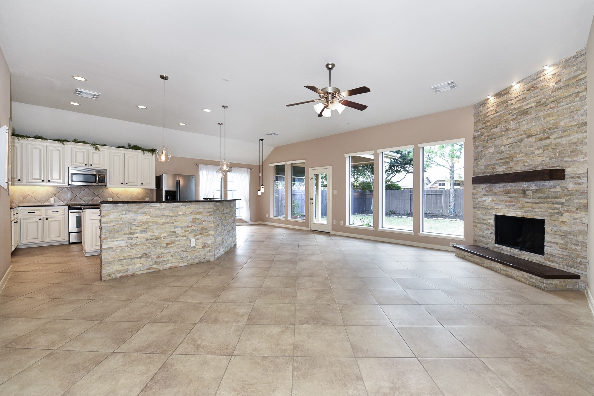 26202 Basil View Lane Katy, TX 77494 - Photo 5 of 29 a large kitchen with stainless steel appliances kitchen island granite countertop a large counter top and stove top oven