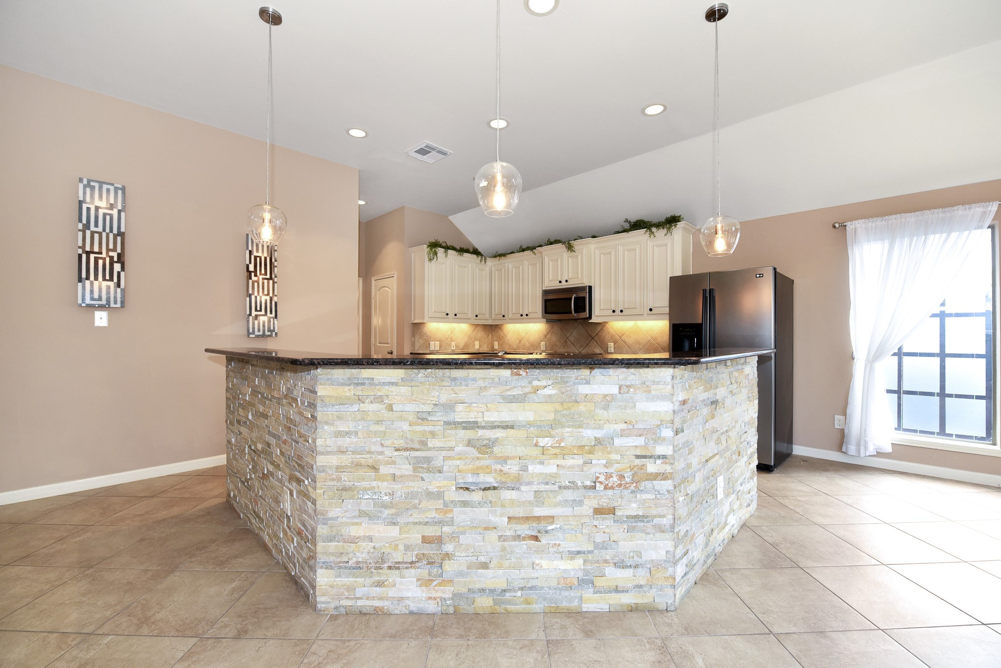 26202 Basil View Lane Katy, TX 77494 - Photo 7 of 29 a kitchen with kitchen island a counter top space a sink stainless steel appliances and a window