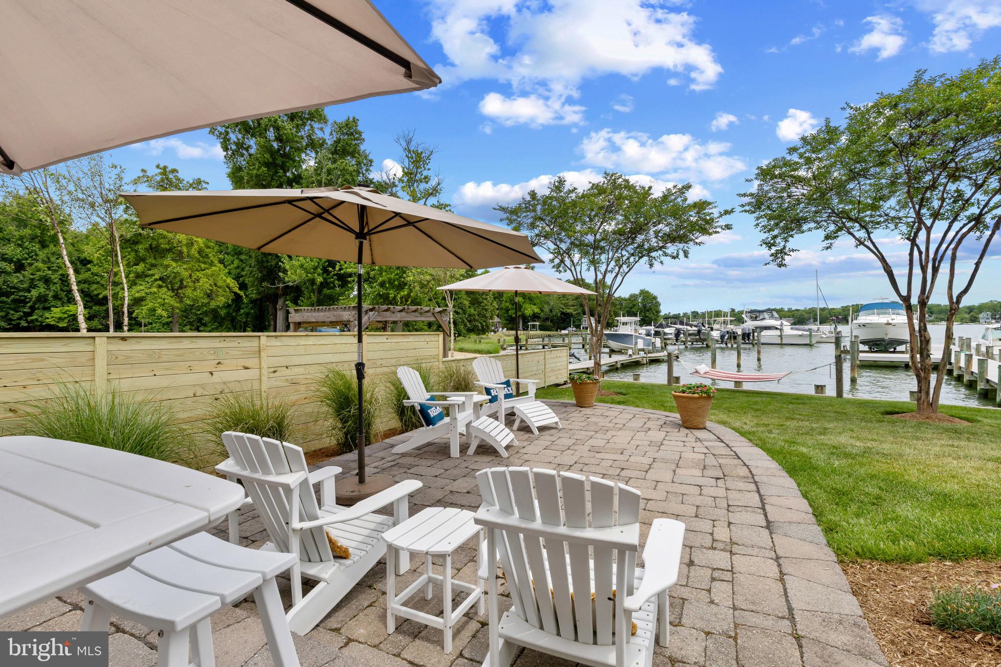 3733 Thomas Point Road Annapolis, MD 21403 - Photo 41 of 46 Expansive waterside patio with shorefront hammock