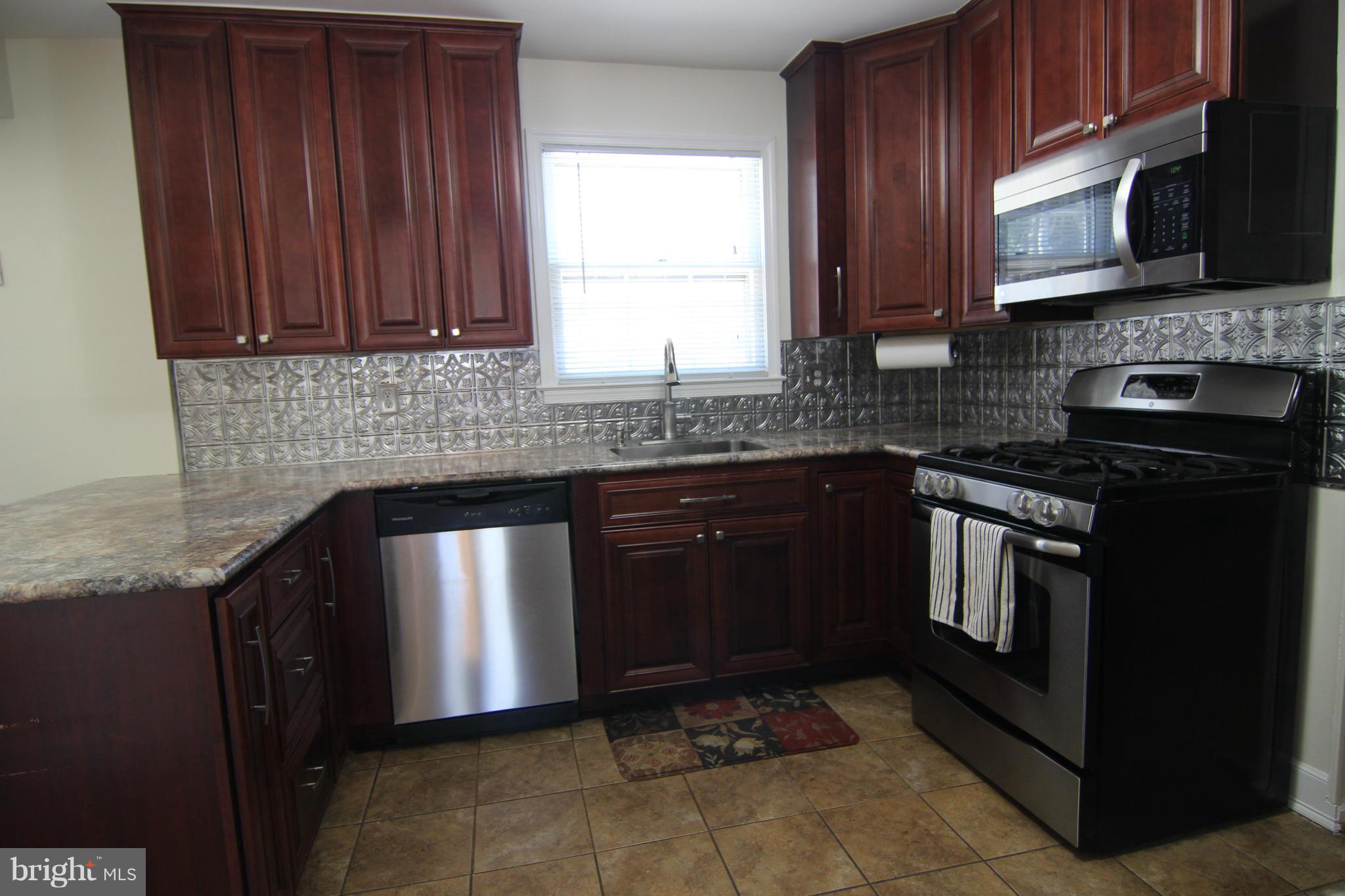 14111 Ansted Road Silver Spring, MD 20905 - Photo 3 of 30 Fully Remodeled - Eat-in Kitchen w/Slider to Patio