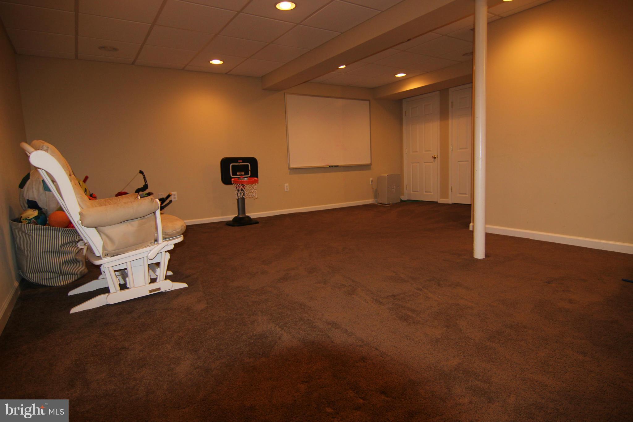 14111 Ansted Road Silver Spring, MD 20905 - Photo 22 of 30 Finished large Rec Room with W/W Carpet.