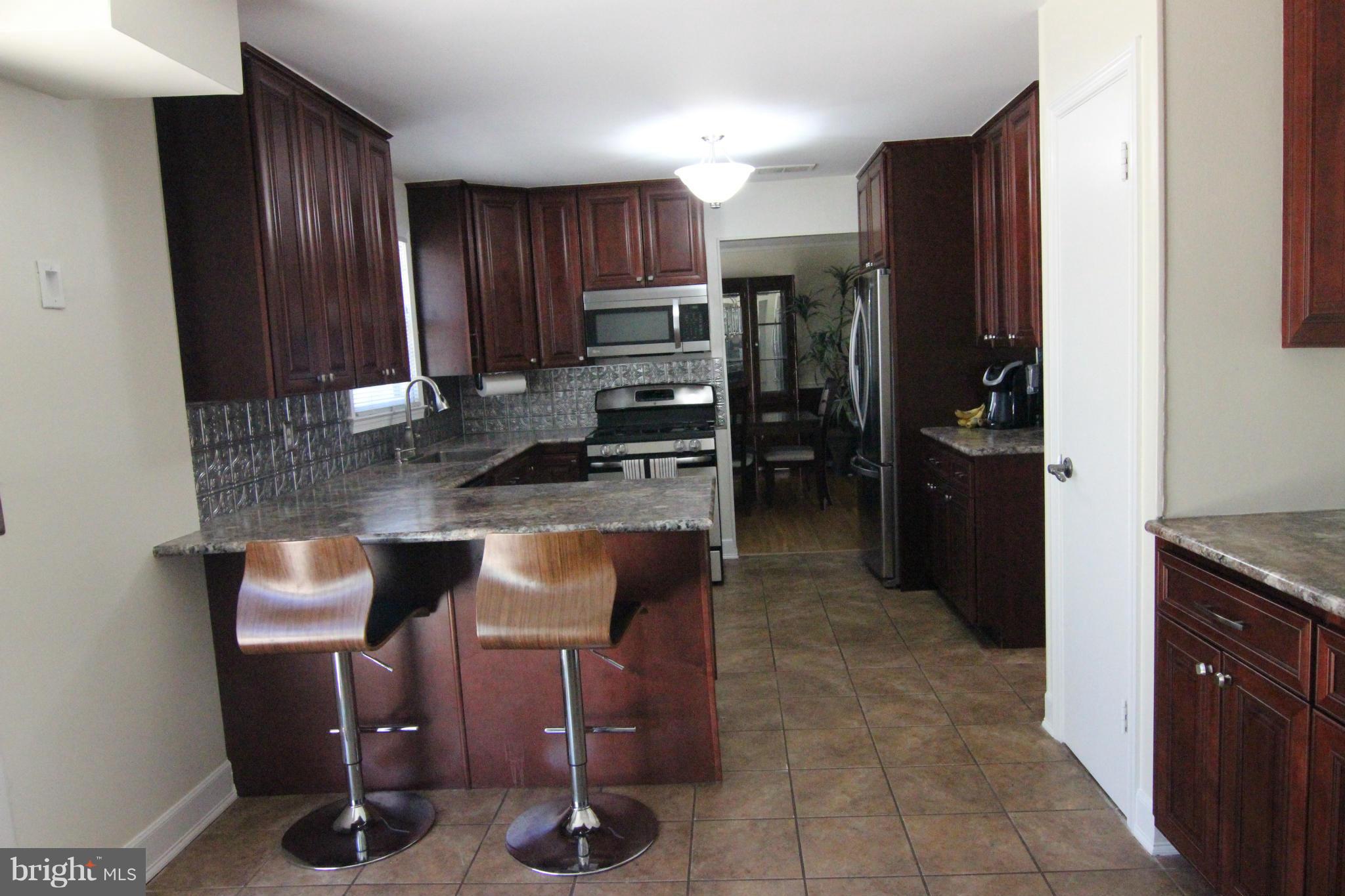 14111 Ansted Road Silver Spring, MD 20905 - Photo 4 of 30 Fully Remodeled - Eat-in Kitchen w/Slider to Patio