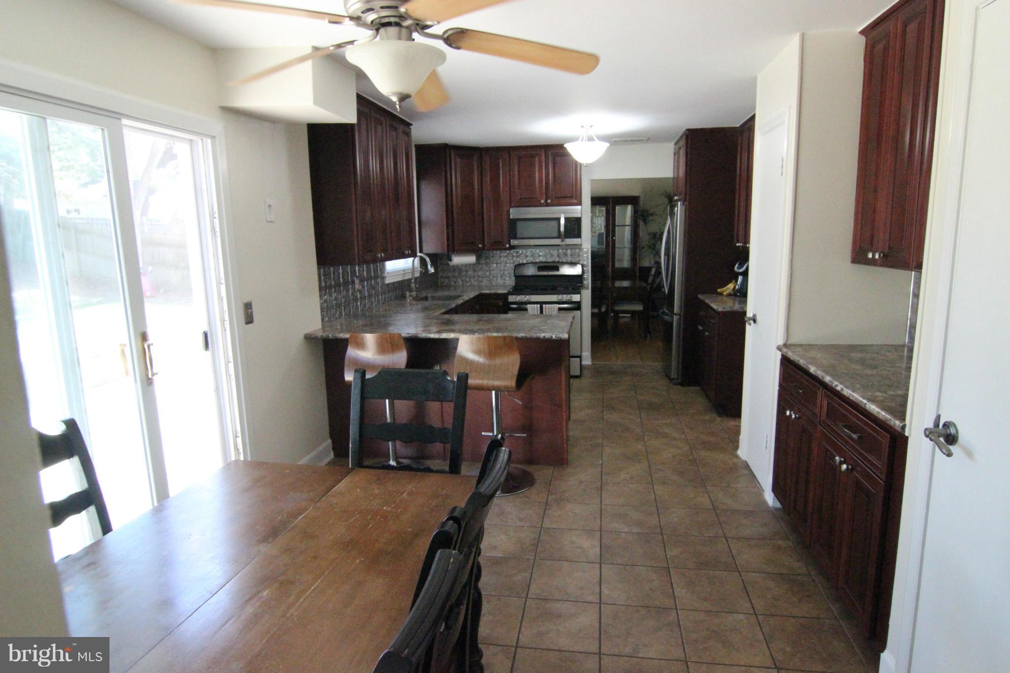 14111 Ansted Road Silver Spring, MD 20905 - Photo 5 of 30 Fully Remodeled - Eat-in Kitchen w/Slider to Patio