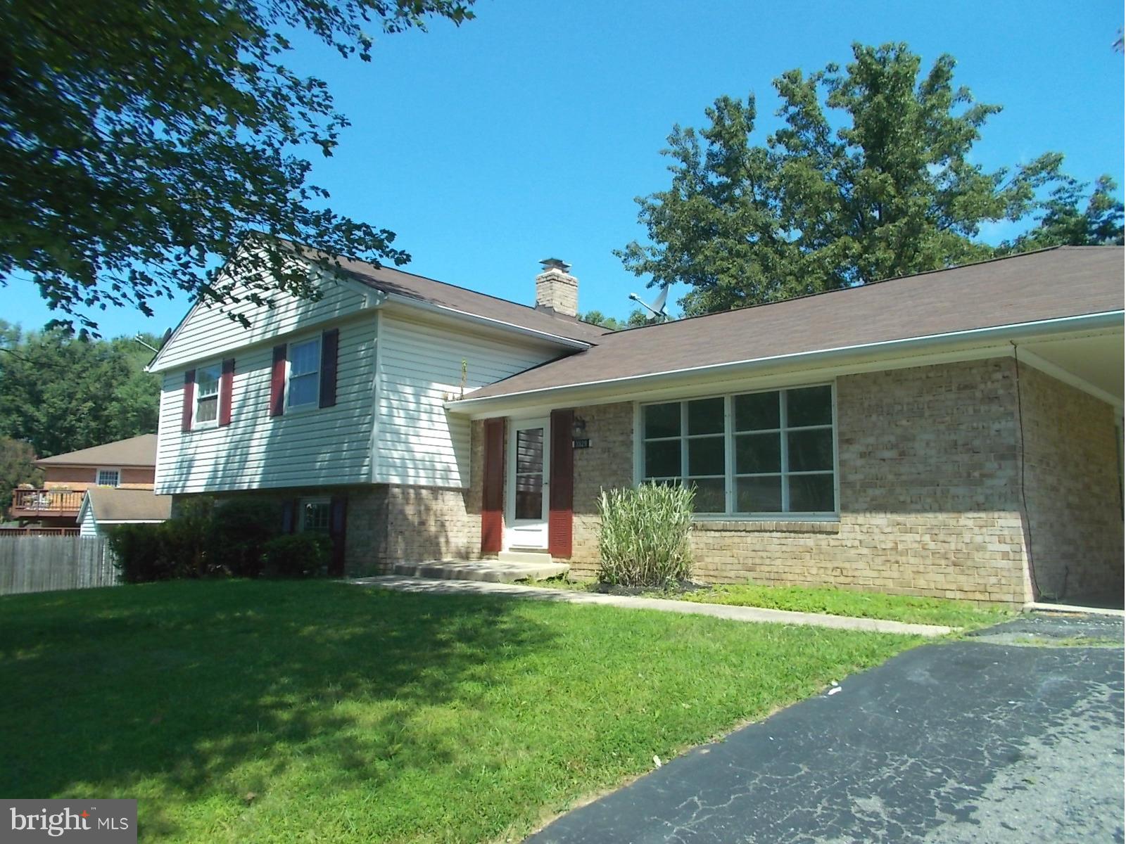 3529 Falling Green Road Olney, MD 20832 - Photo 1 of 16 a front view of a house with a yard and garage