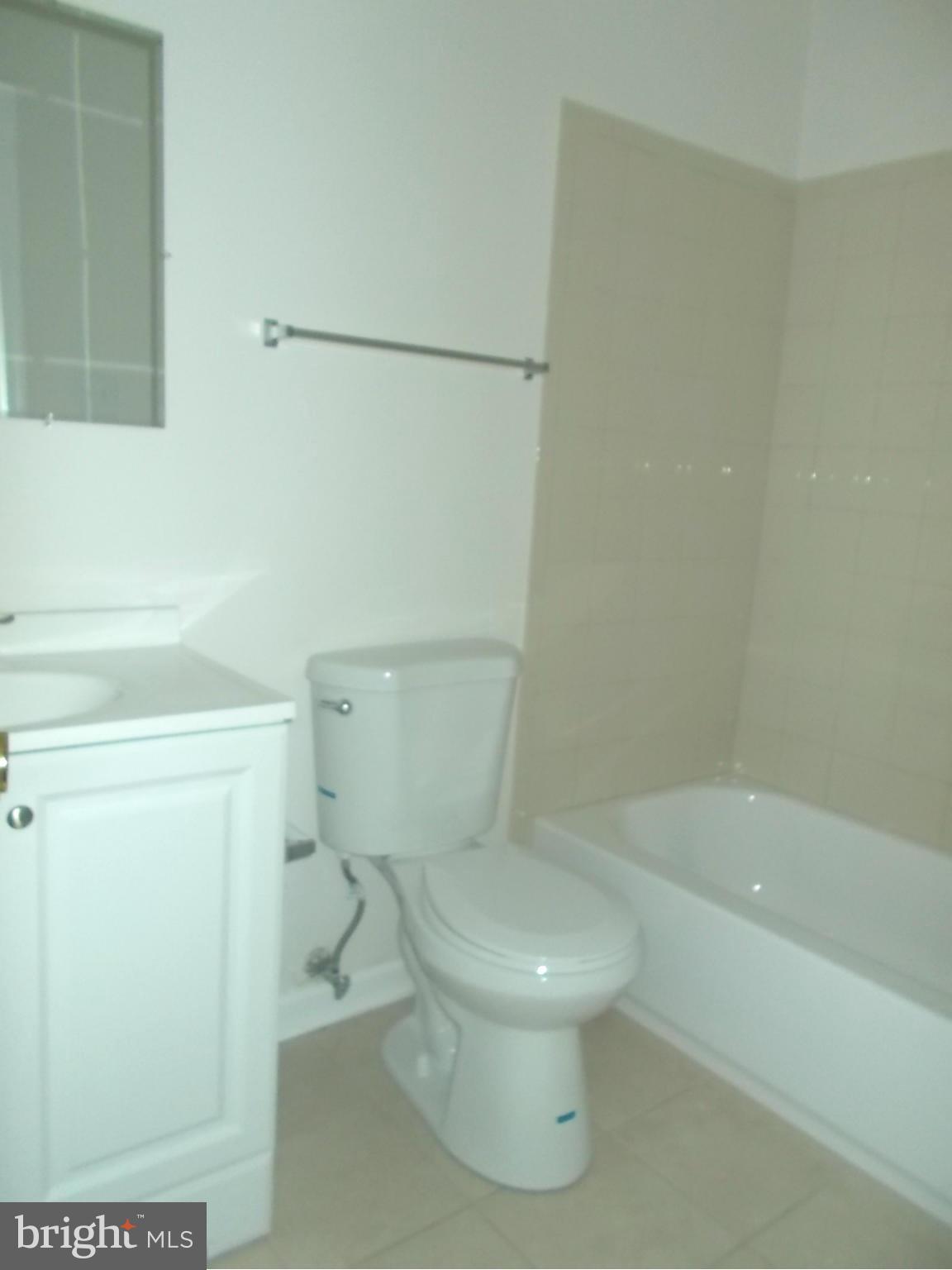 3529 Falling Green Road Olney, MD 20832 - Photo 11 of 16 a white toilet sitting next to a bath tub