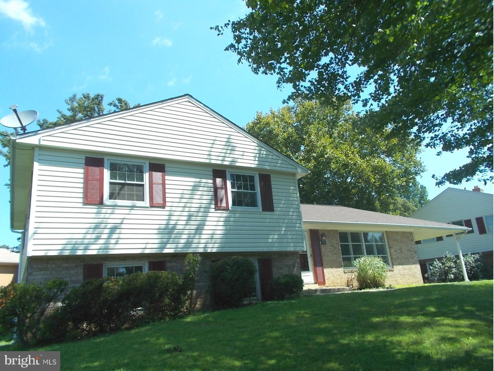3529 Falling Green Road Olney, MD 20832 - Photo 2 of 16 a front view of a house with a yard