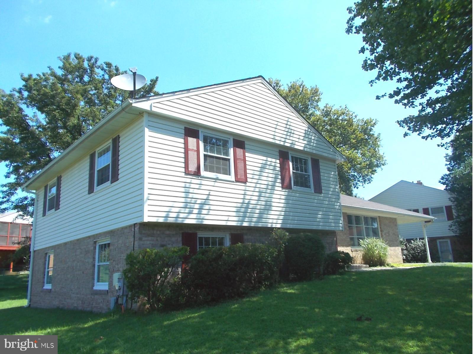 3529 Falling Green Road Olney, MD 20832 - Photo 3 of 16 a view of a house with a yard and potted plants