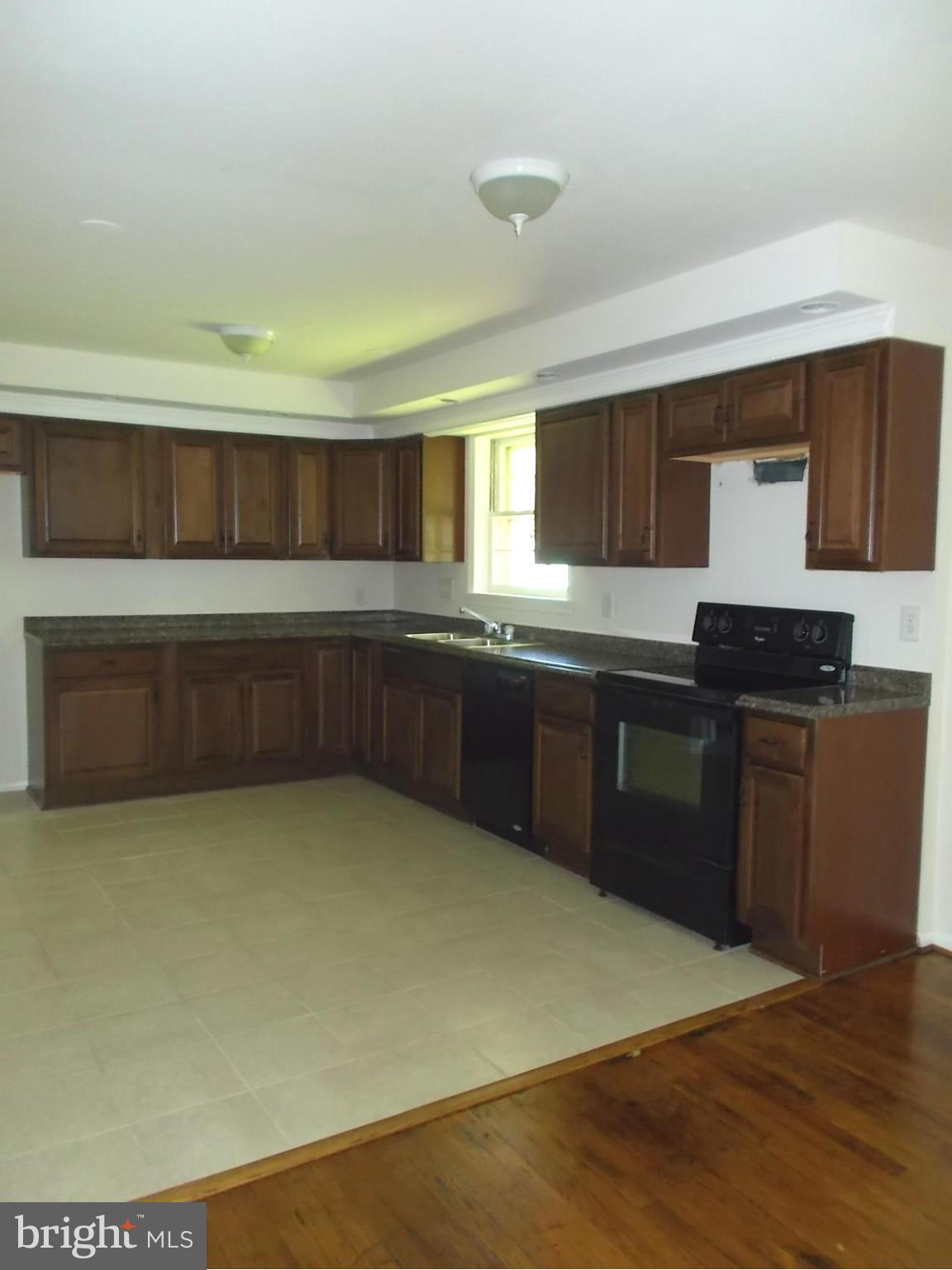 3529 Falling Green Road Olney, MD 20832 - Photo 8 of 16 a kitchen with a sink and cabinets