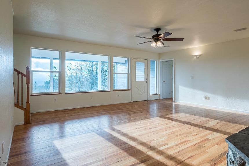 6550 Beagle Road White City, OR 97503 - Photo 5 of 24 wooden floor in an empty room with a window
