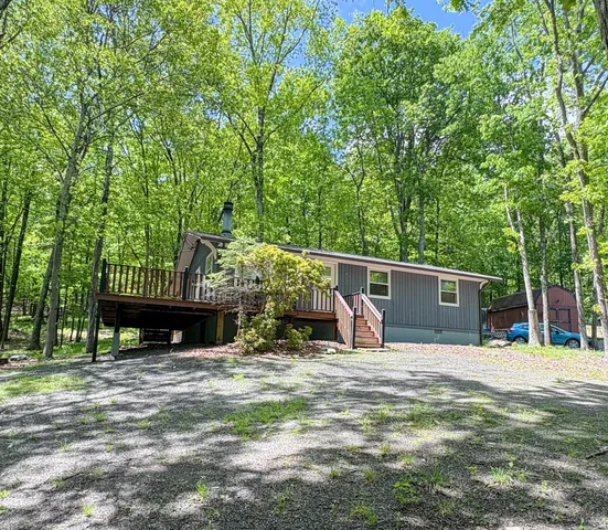 a view of a wooden fence and a yard