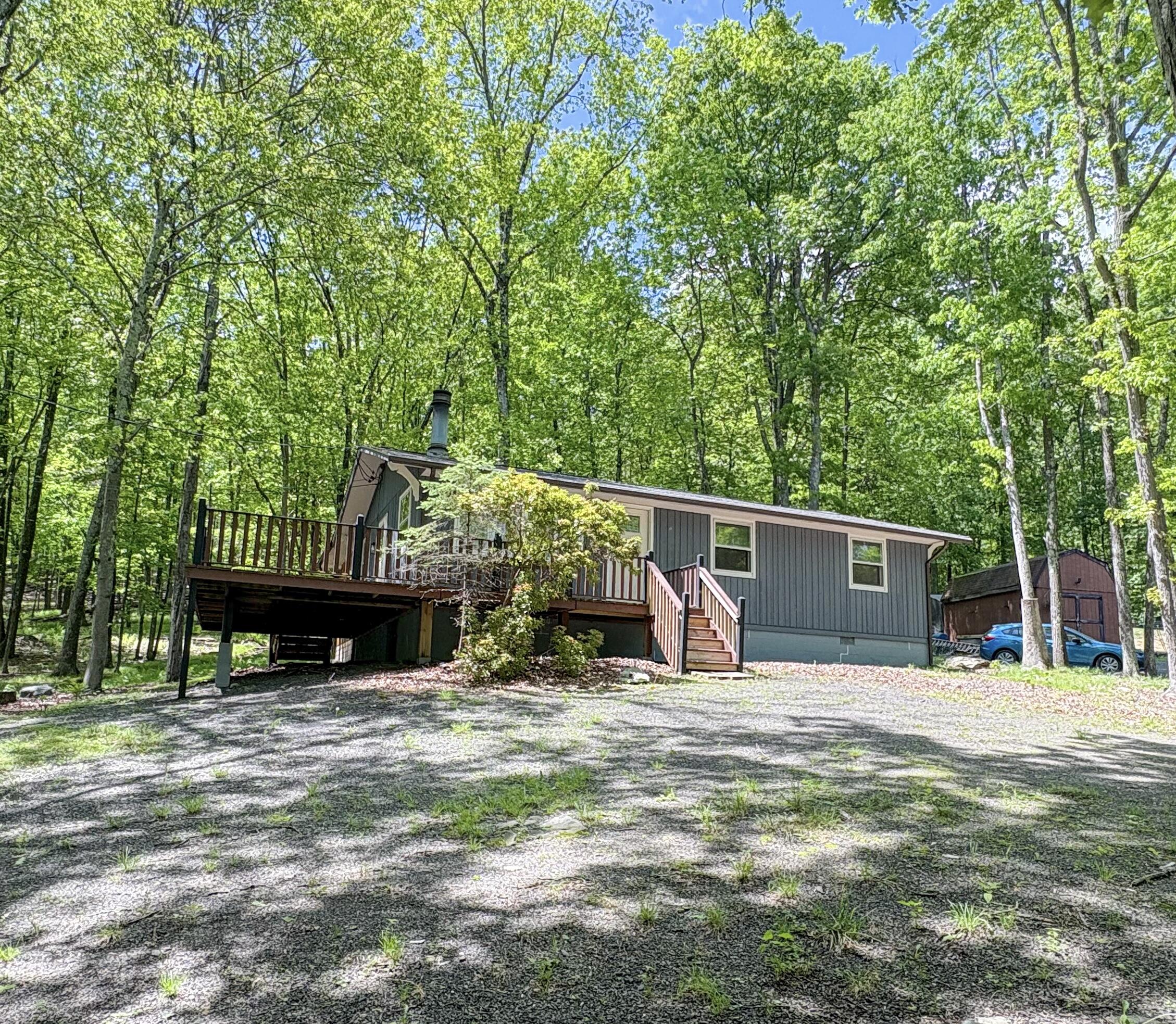 a view of a wooden fence and a yard