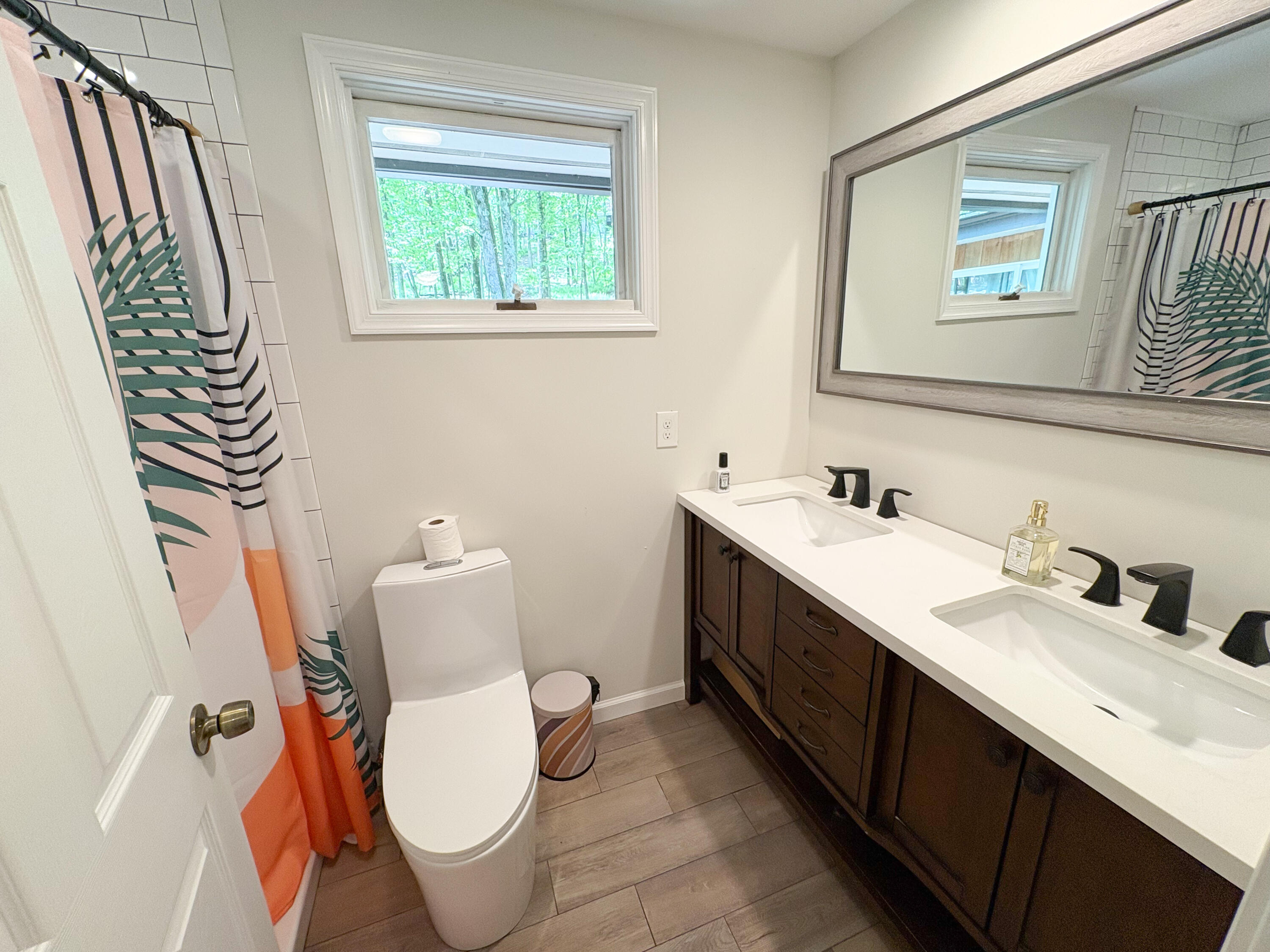 1085 Maple Lake Drive Bushkill, PA 18324 - Photo 19 of 35 a spacious bathroom with a toilet sink and mirror